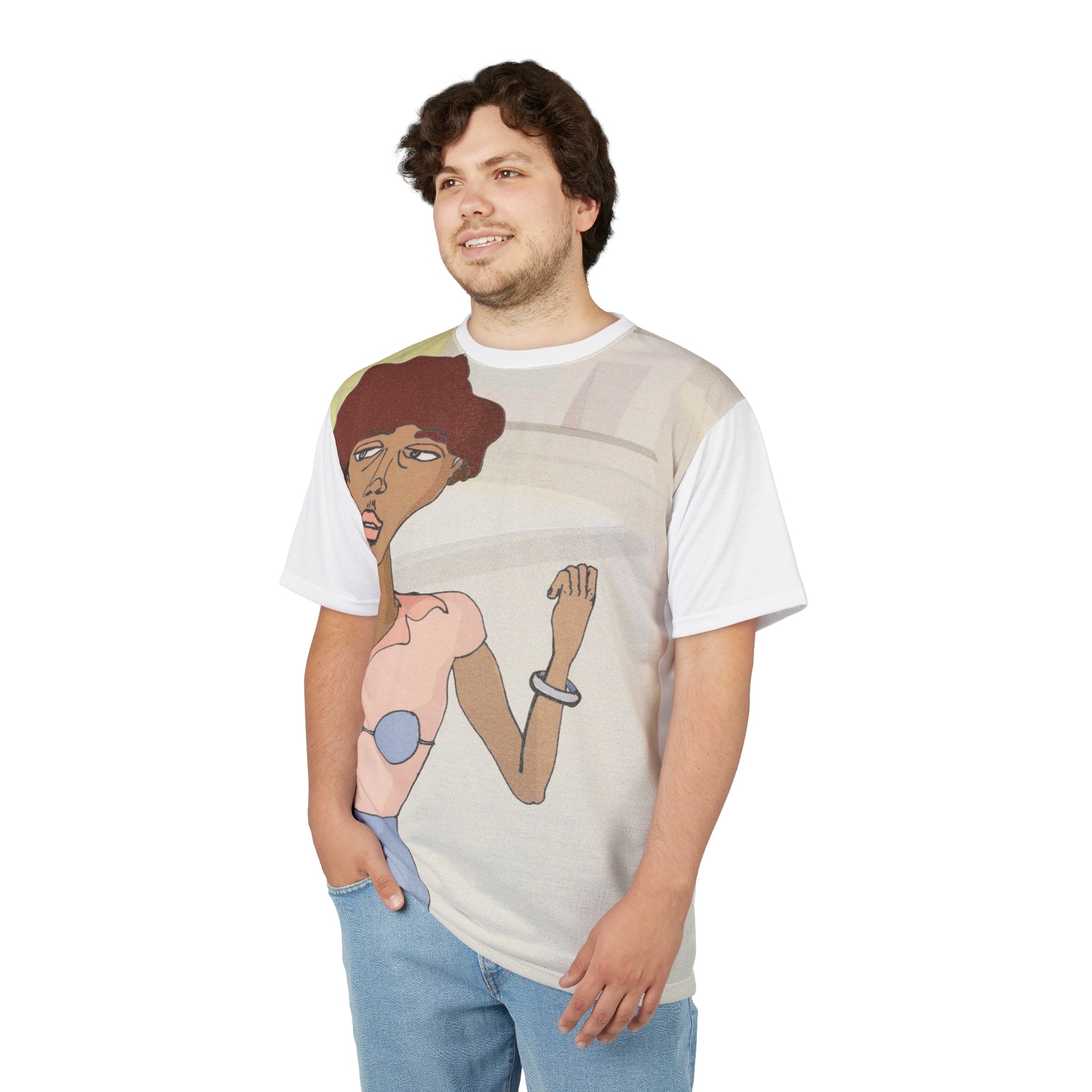A young man wearing a Unisex t-shirt featuring a hand-drawn Afro-Latina woman with reddish black hair and expressive pose