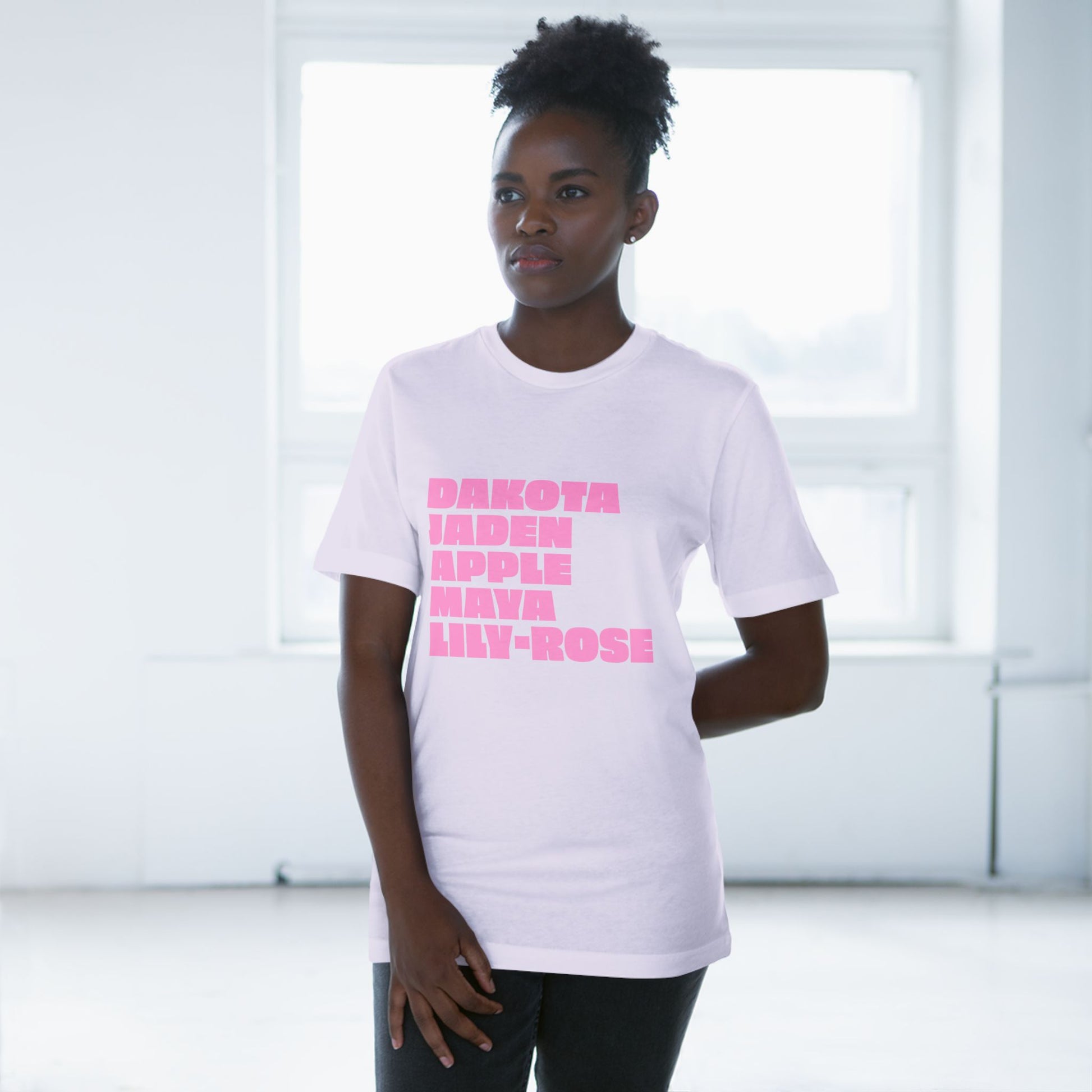 Lavender Nepo Babies List T-Shirt with pink lettering worn by female model