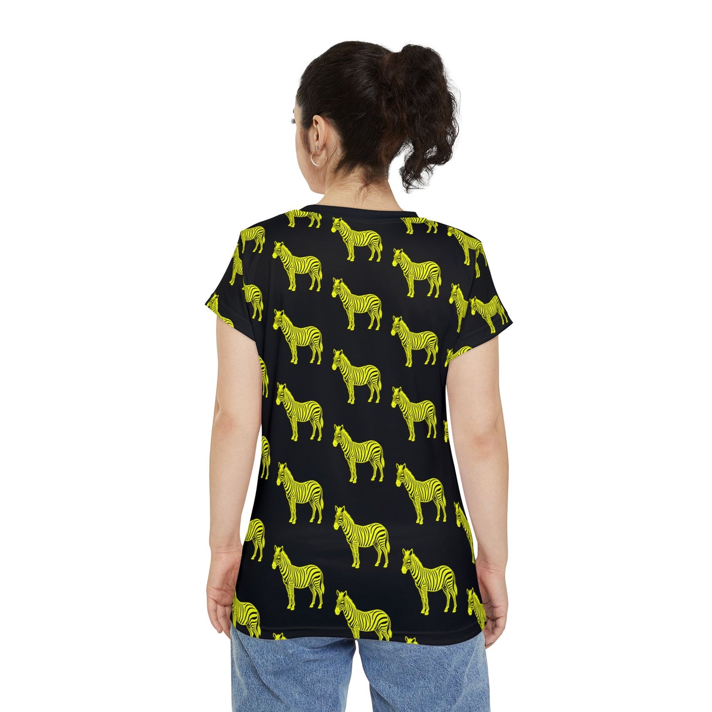 Back view of woman wearing Yellow Zebra Women's T-Shirt, showing full neon zebra design on black fabric.