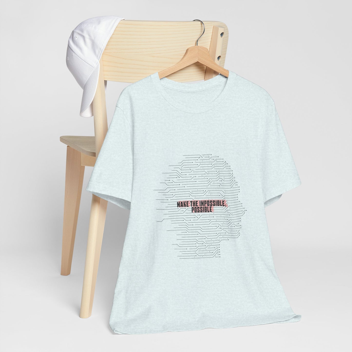 Light blue Make It Possible T-Shirt worn by woman with bold text.