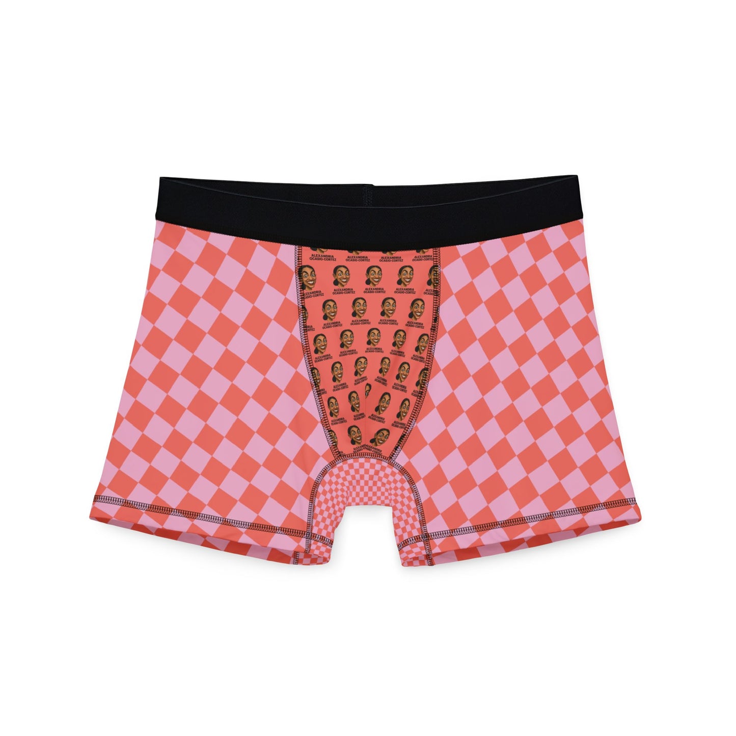 Flat lay of pink and red checkered boxer briefs with black waistband and AOC face pattern on pouch area.