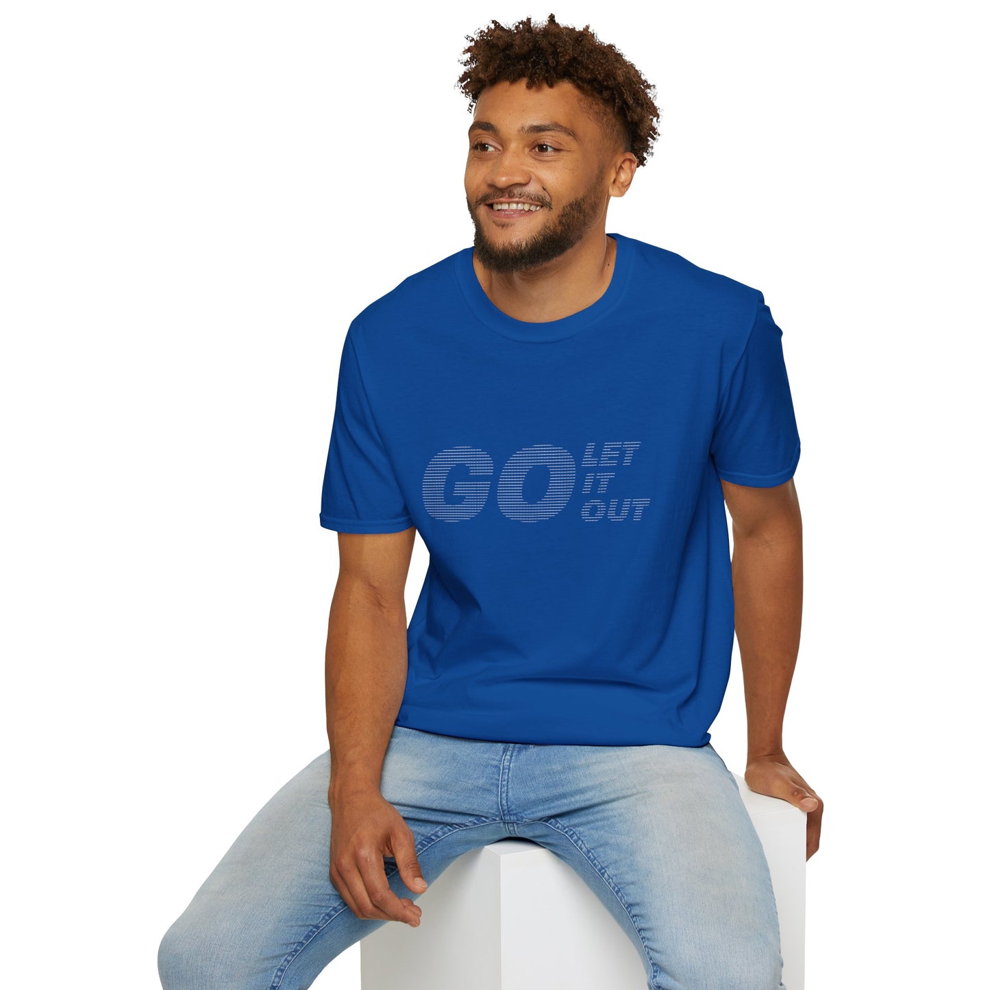 Man sitting in blue Oasis Go Let It Out stencil t-shirt, smiling.