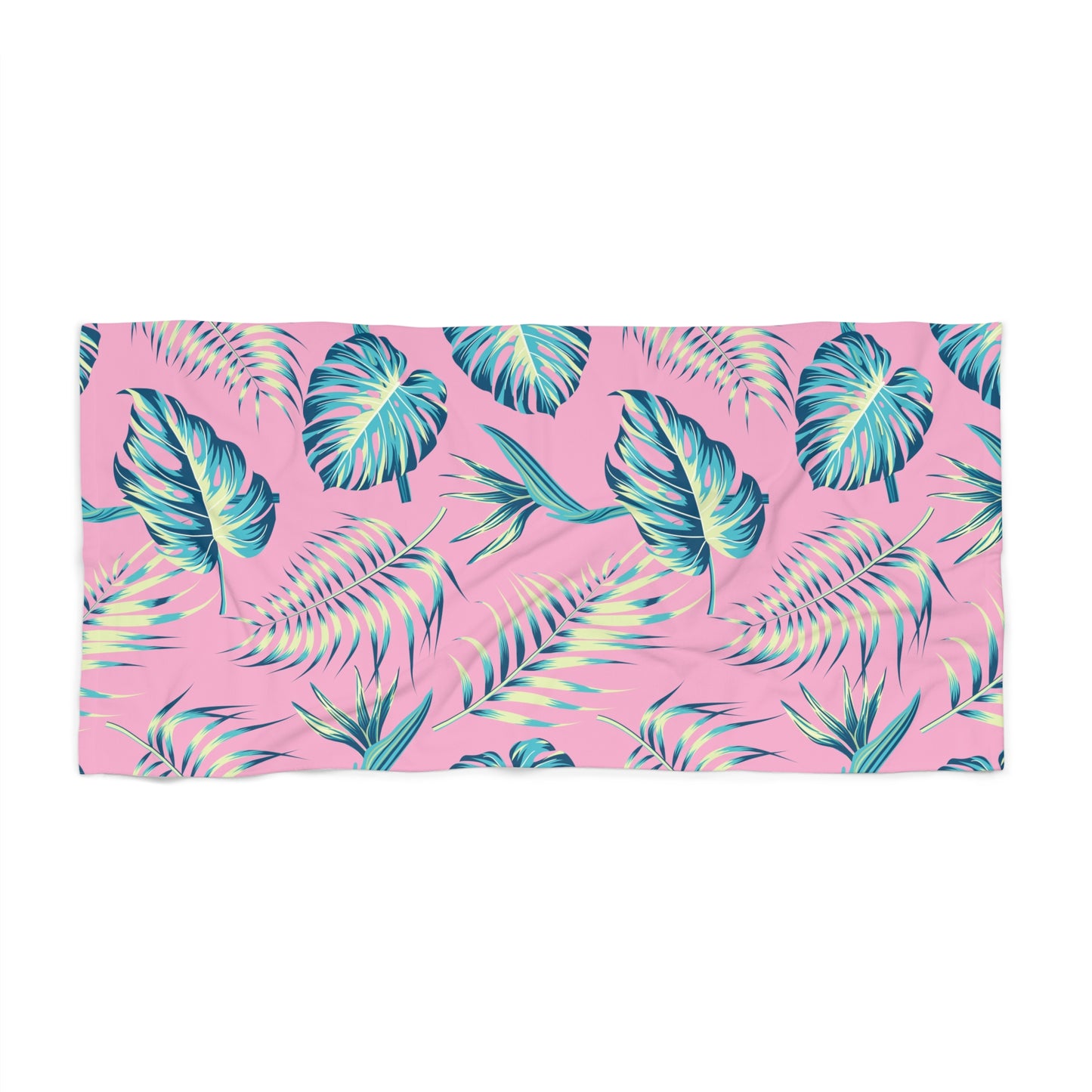 Towel with tropical leaf pattern on a pink background