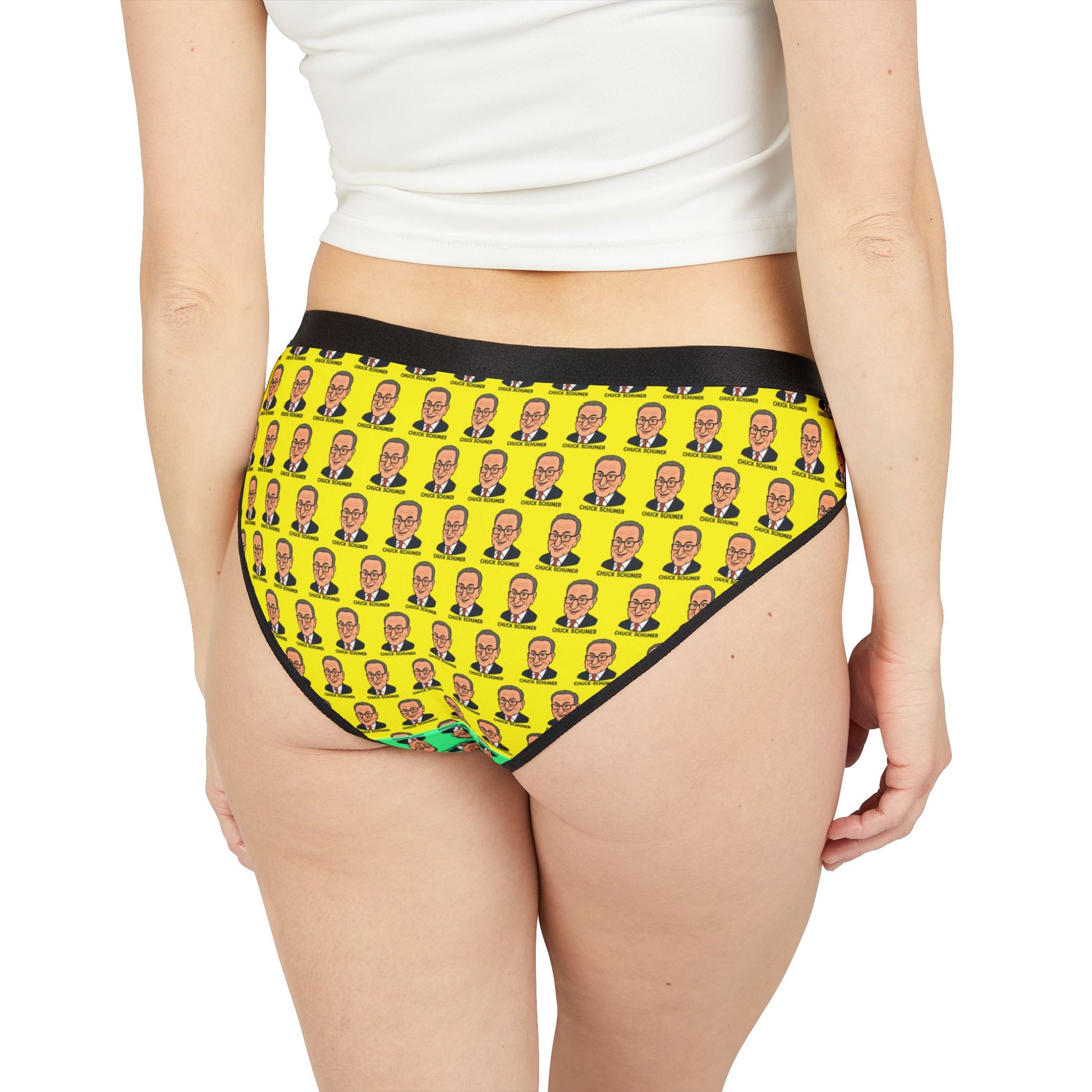 Model from behind wearing Chuck Schumer face print underwear with yellow background and black waistband