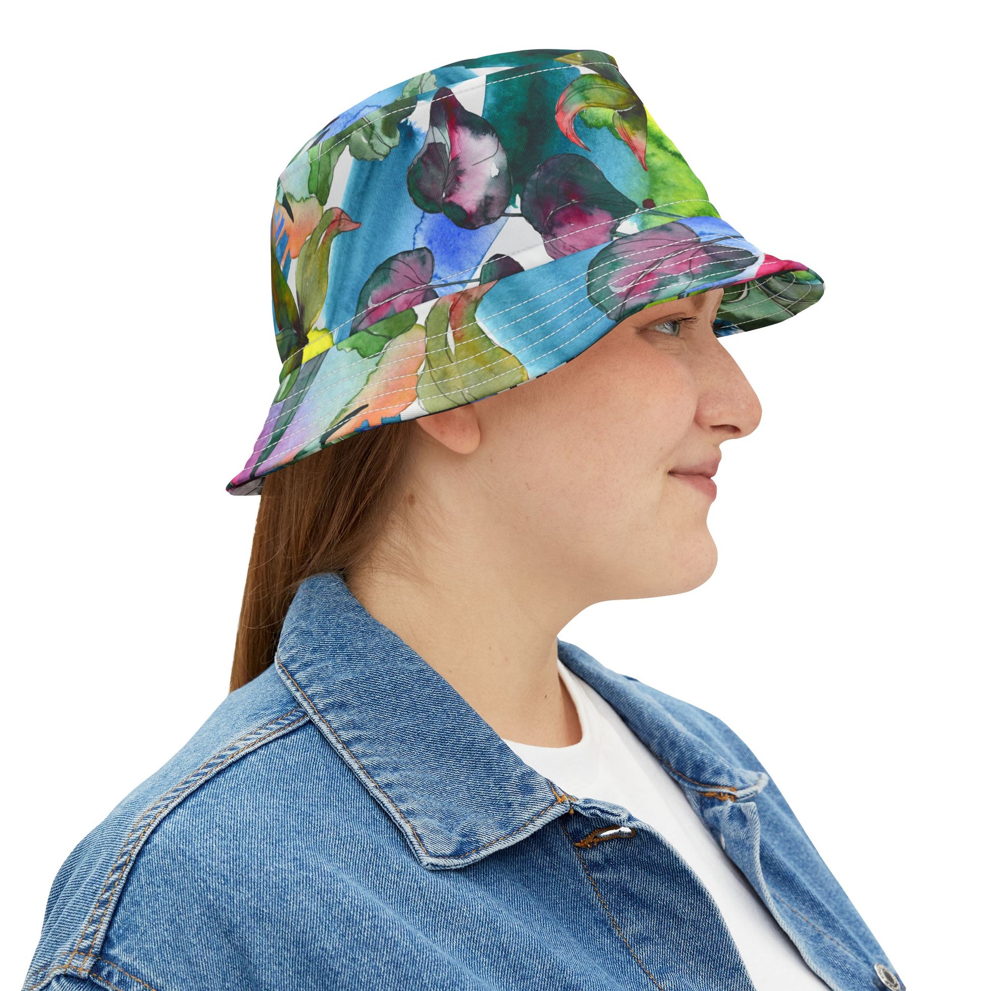 Woman wearing Acquarela Bucket Hat, smiling softly in side profile.