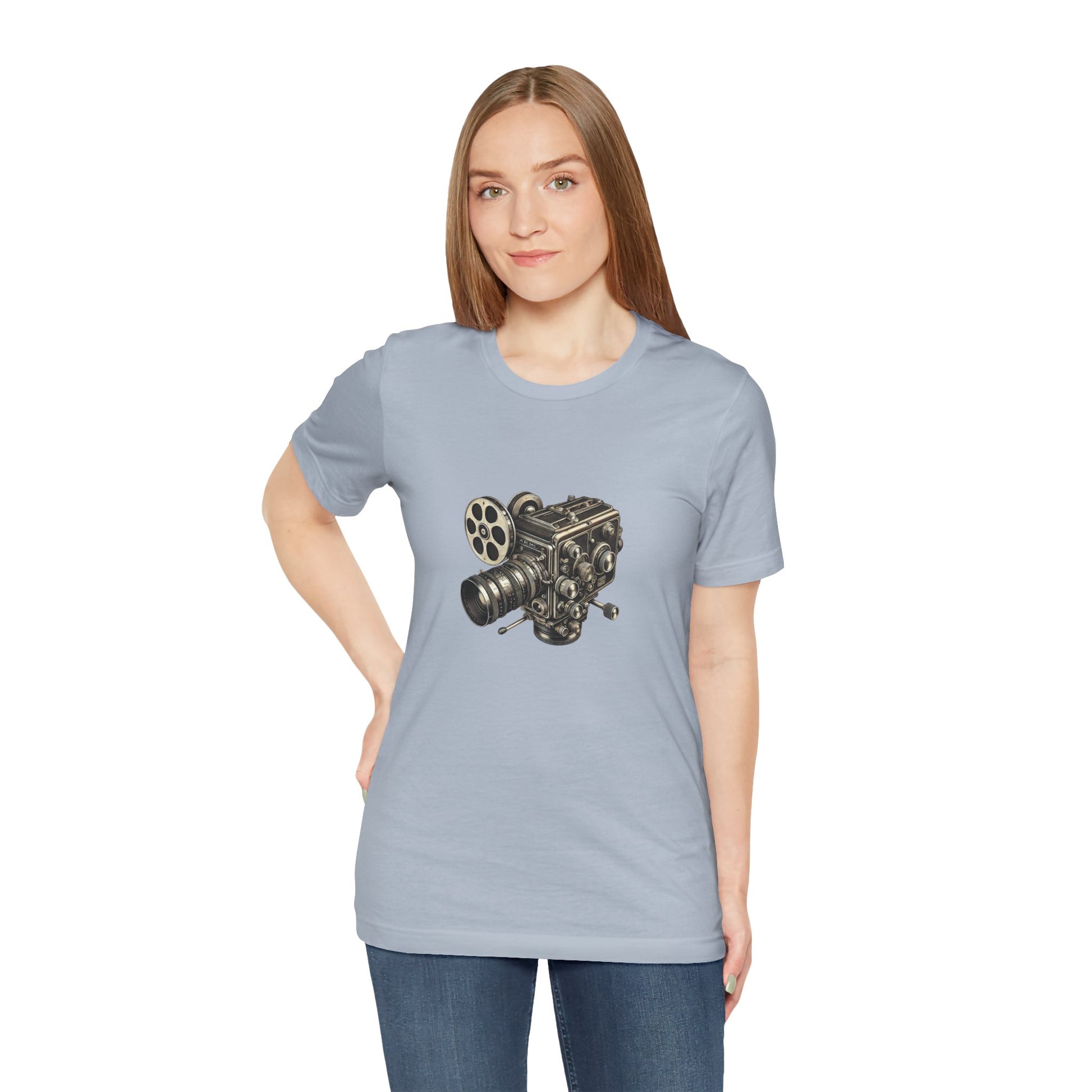 Woman wearing light blue t-shirt with vintage 16mm camera design and jeans
