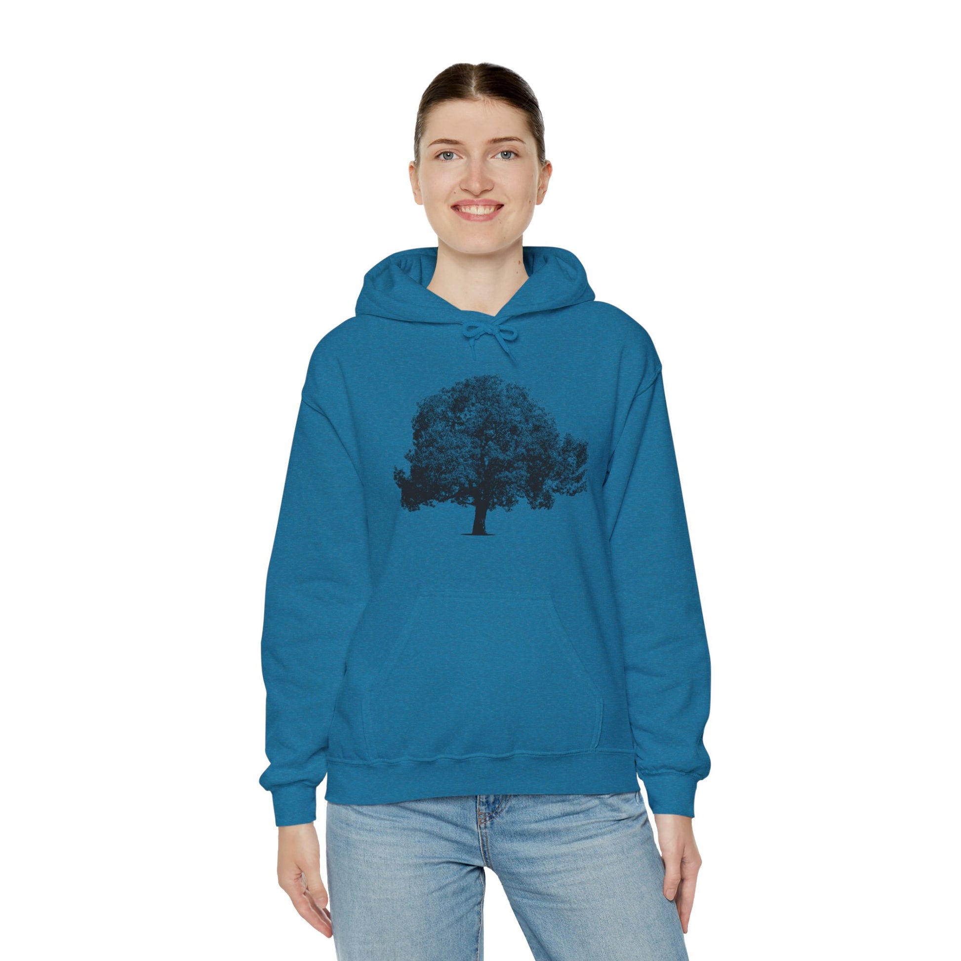 Woman wearing dark blue Tree Hoodie with black tree graphic