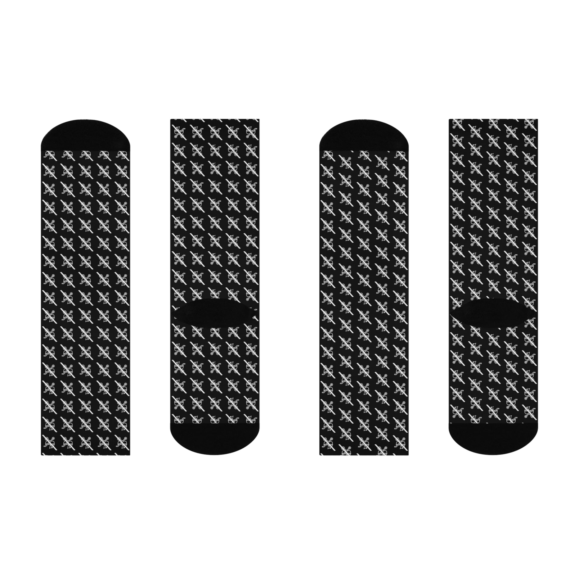 Four black socks with white pattern on a white background