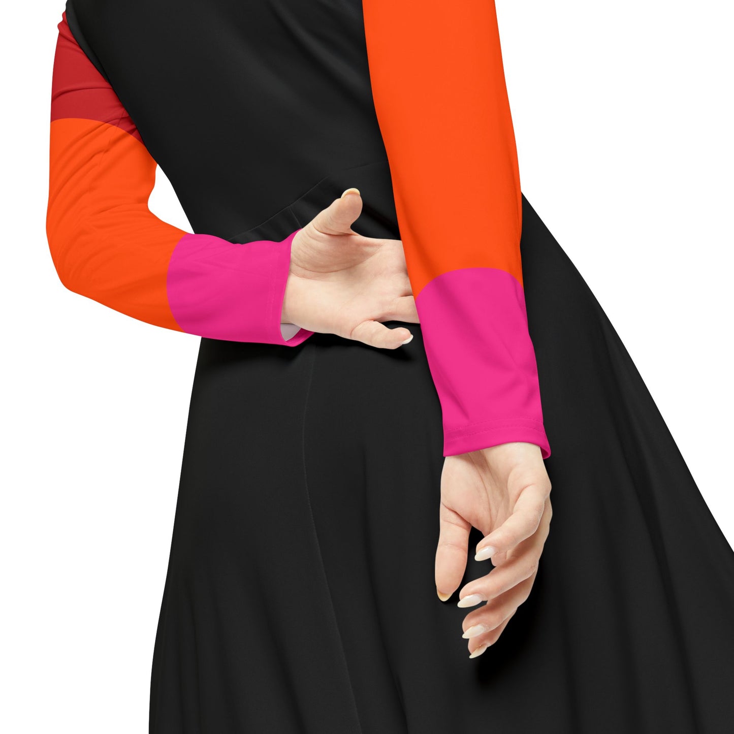 Detal of a long-sleeved A-line dress featuring a retro video game theme, with colorful ghost characters and a pixel-style yellow character reminiscent of Pac-Man on a black background, and bright red-orange-pink gradient sleeves.