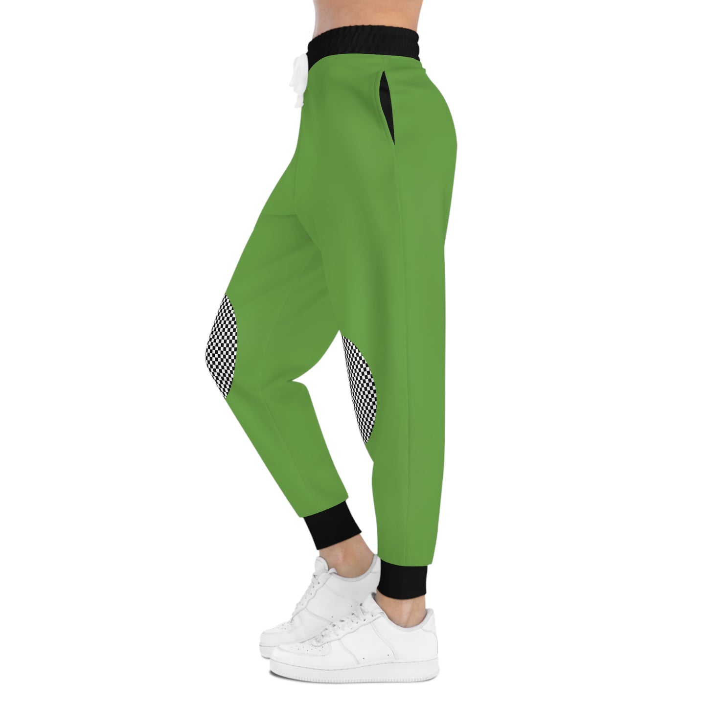 Side view of green joggers with checkered knee patches showing tapered leg and ankle cuffs