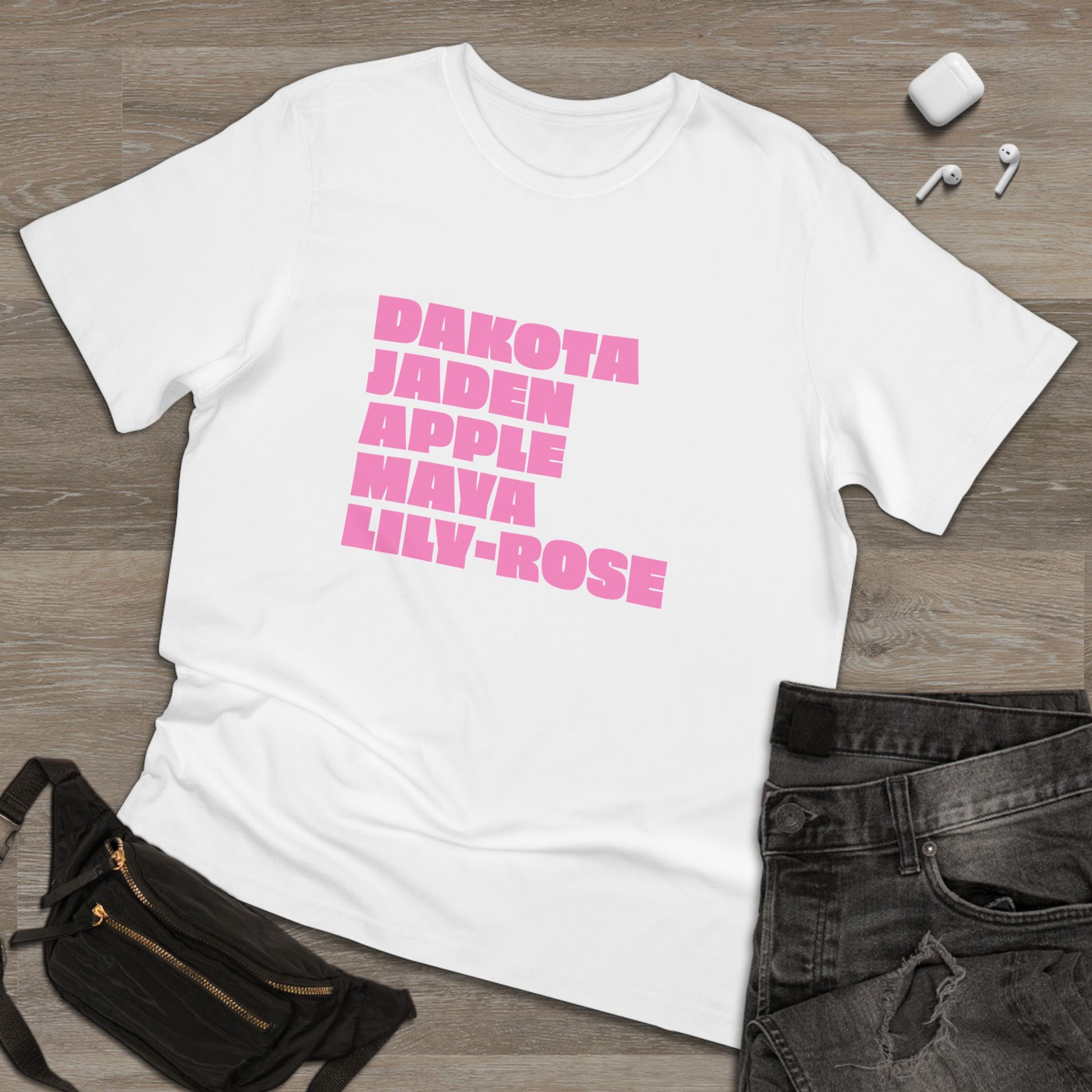 White Nepo Babies List T-Shirt with pink lettering on hanger