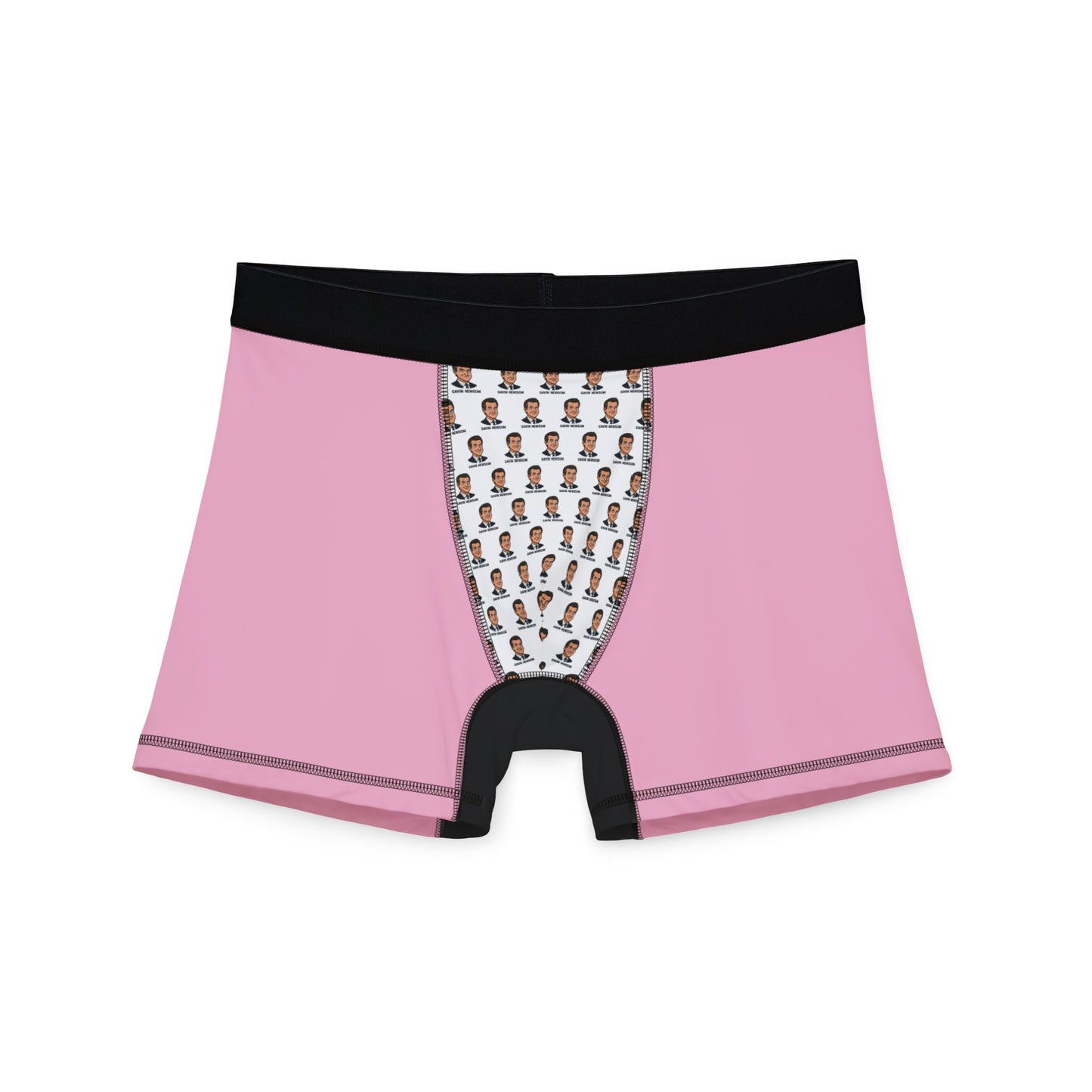 Flat lay of Gavin Newsom boxer briefs showing pink fabric, black trim, and white pouch with Newsom face print.