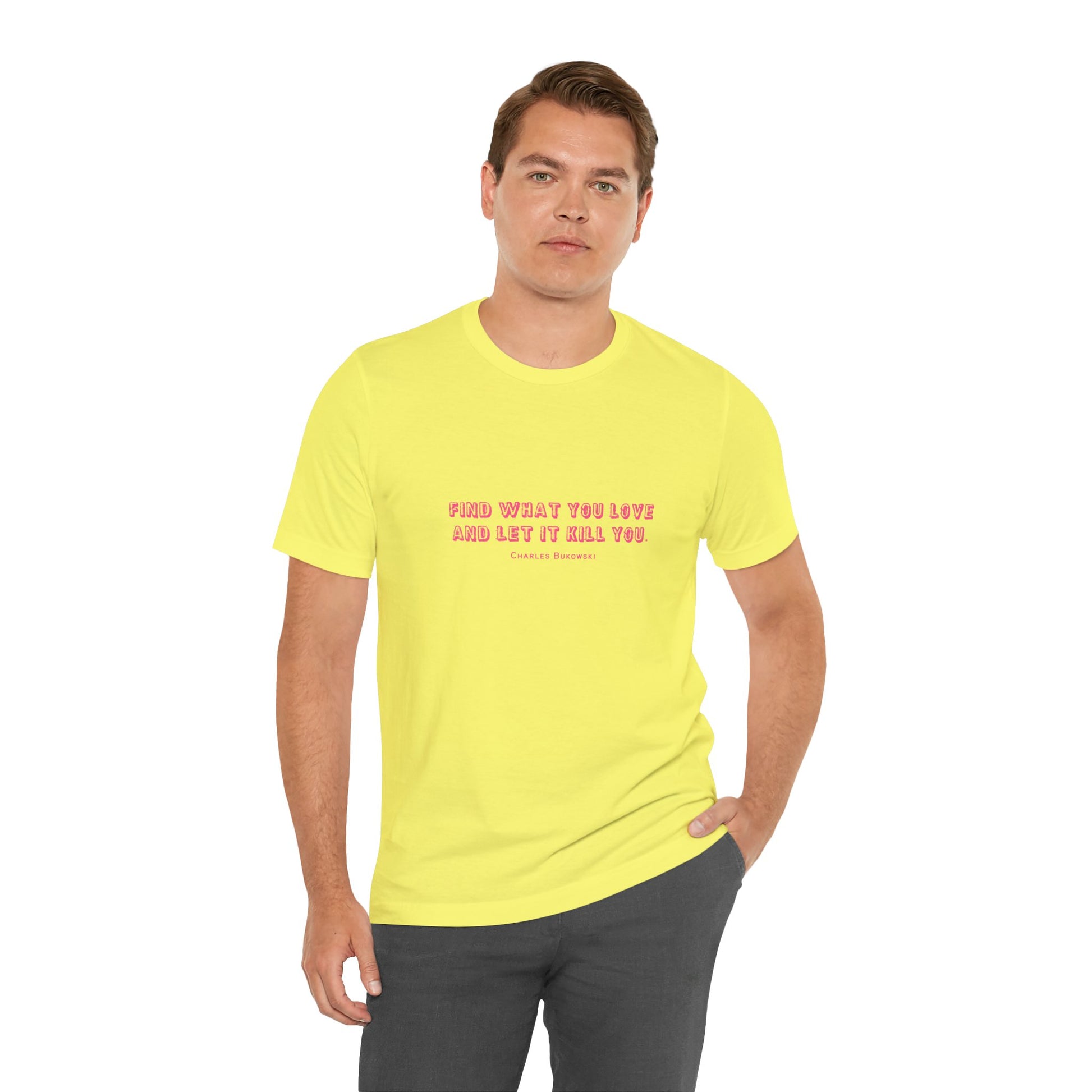 Man wearing a yellow Bukowski quote t-shirt with dark blue pants