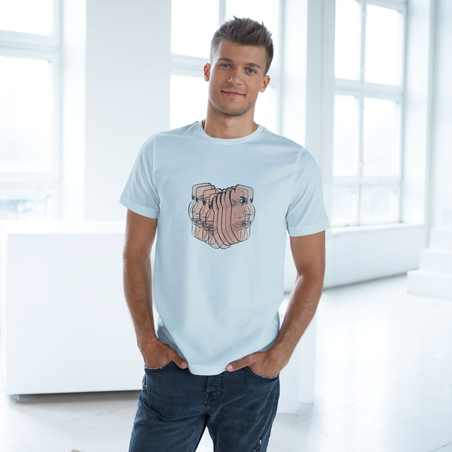 Male model wearing Charlie Unisex Deluxe T-Shirt in light blue featuring abstract face illustration