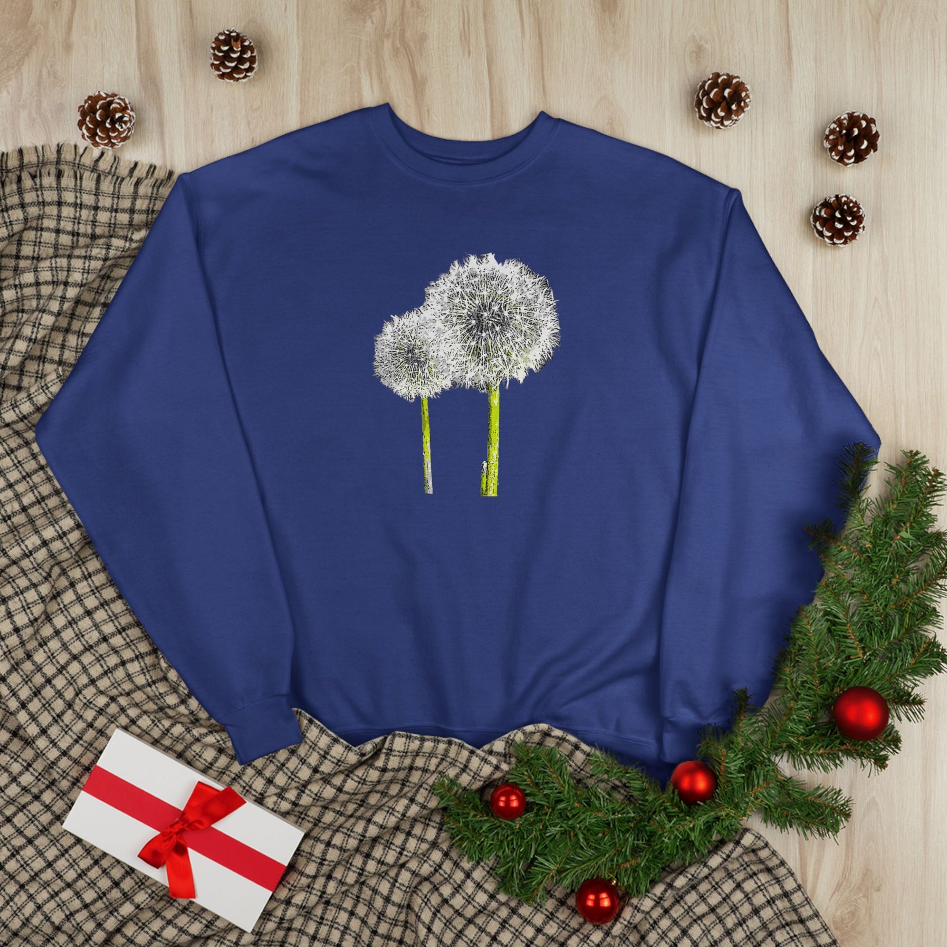 Blue Tantrum Media Dandelion Unisex Sweatshirt with white dandelion print, holiday decor flat lay
