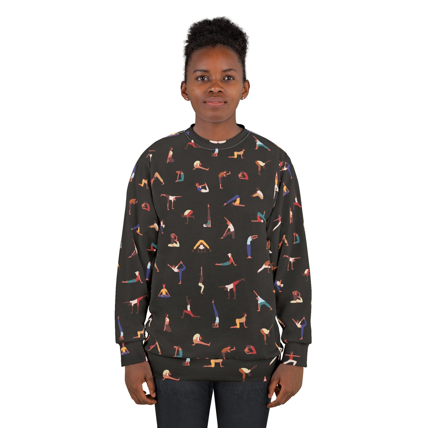 Woman wearing a black sweatshirt with colorful yoga pose pattern on a white background