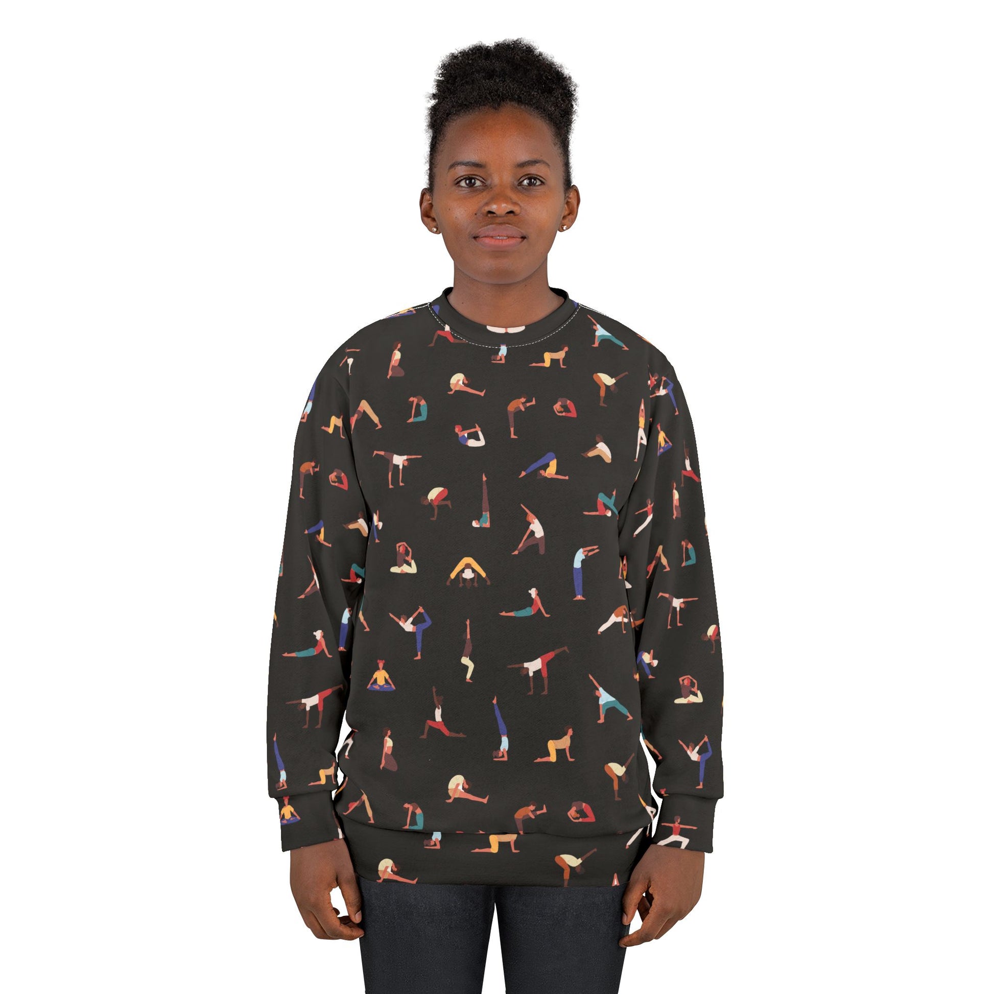 Woman wearing a black sweatshirt with colorful yoga pose pattern on a white background