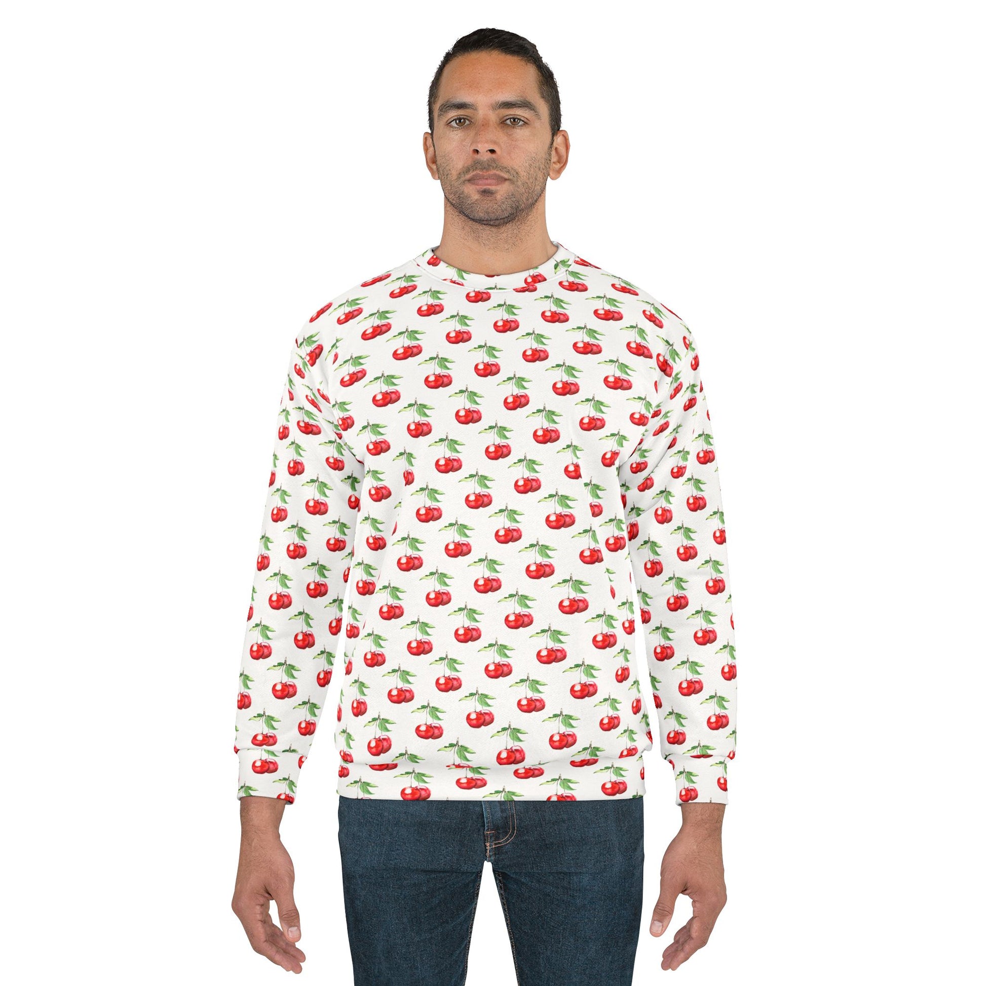 Man wearing the Sweet Cherry Unisex Sweatshirt with vibrant cherry print and casual styling.