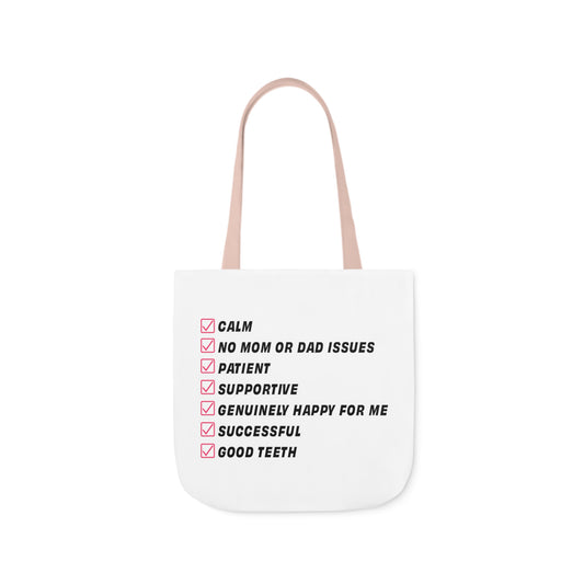 White tote bag featuring a humorous checklist with qualities like calm, patient, supportive, and good teeth