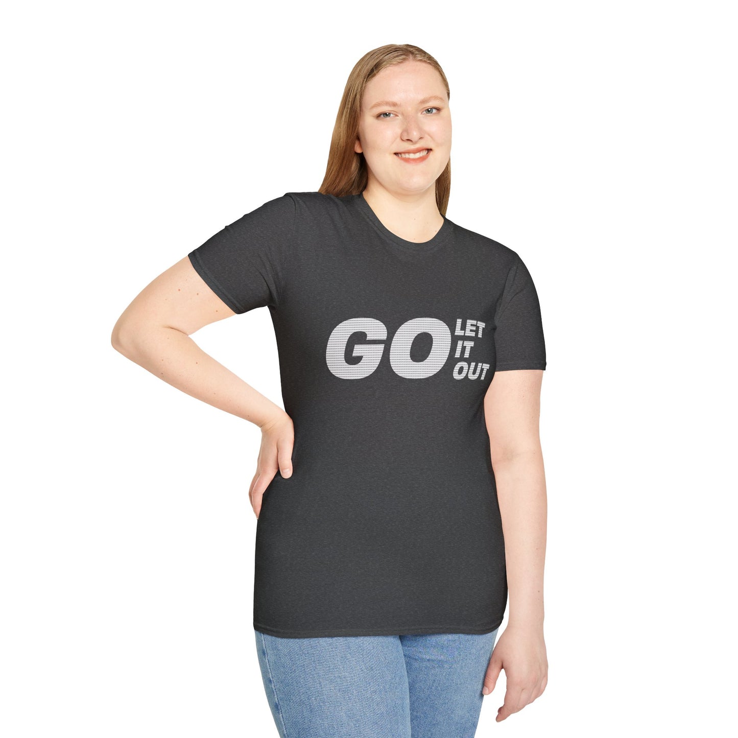 Woman wearing gray Oasis Go Let It Out T-shirt, smiling with hands in pockets