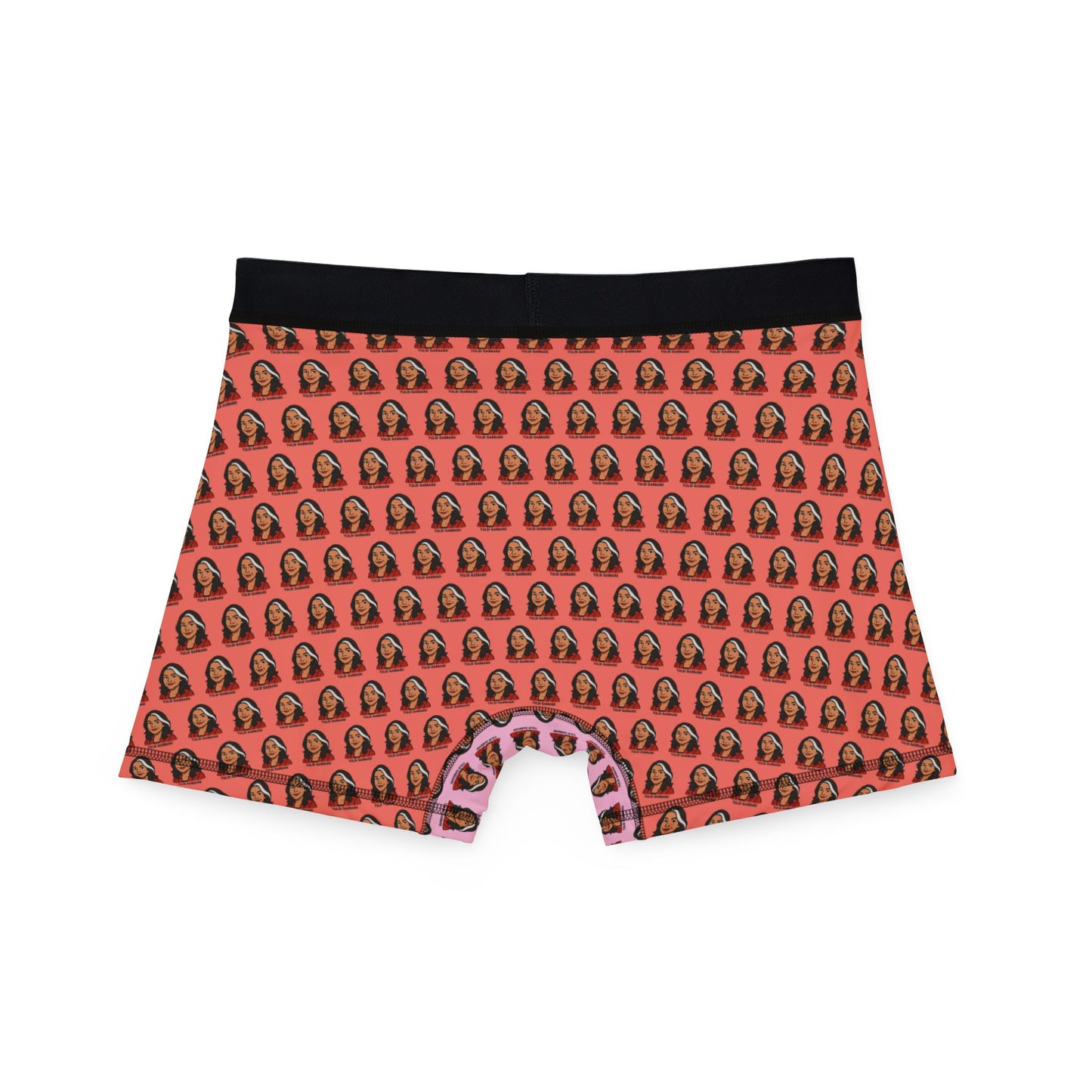 Back view of Tulsi Gabbard boxer briefs featuring all-over face pattern on orange background with black waistband