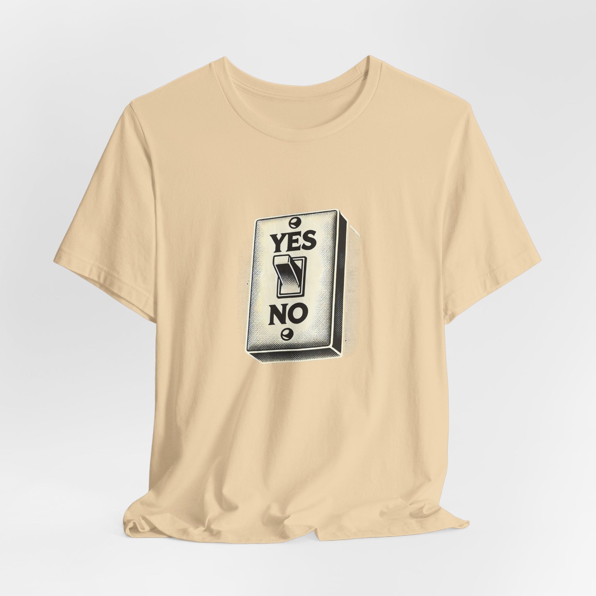 Flat lay of yellow YES/NO Switch Tee with centered light switch print