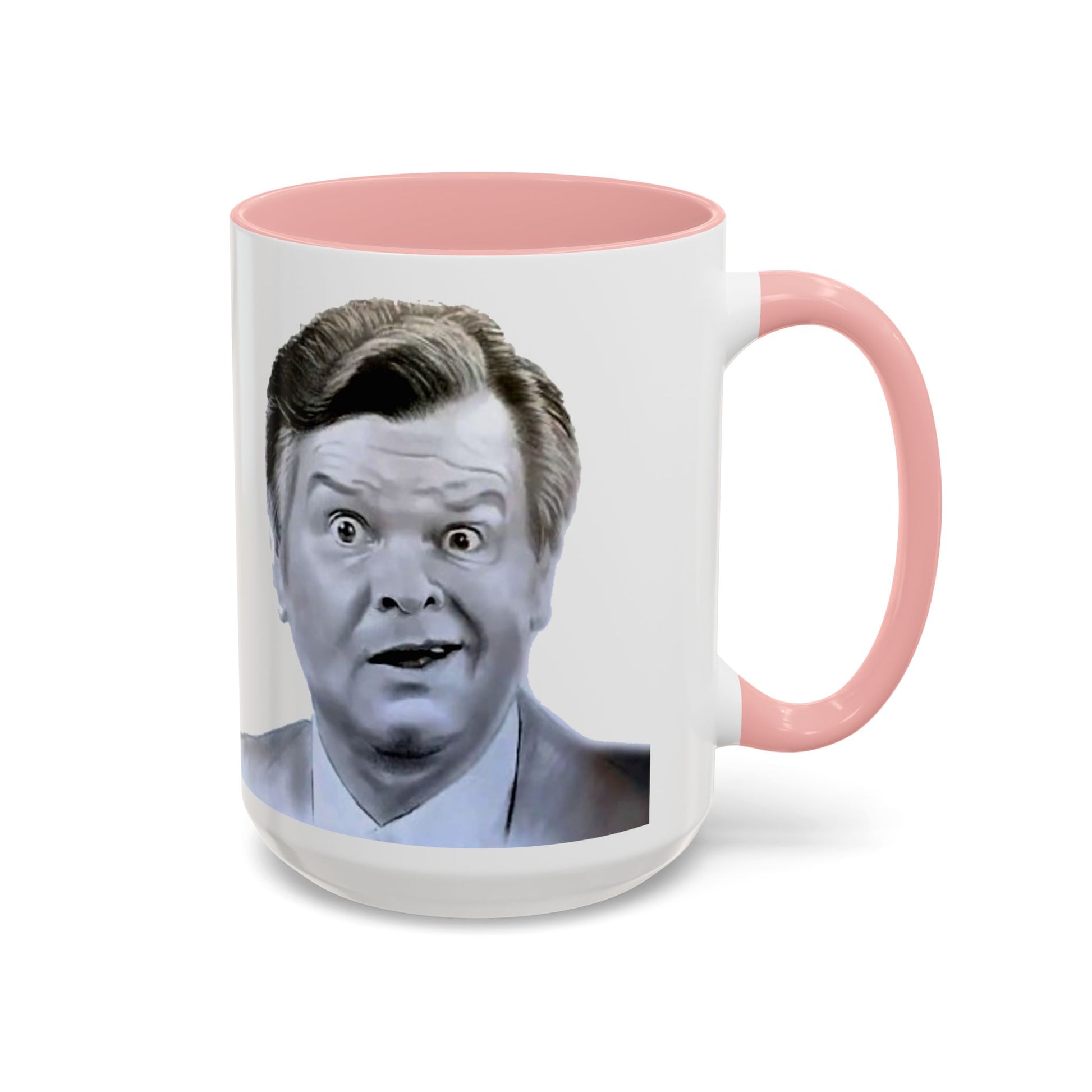 White mug with pink handle featuring a grayscale portrait of Benny Hill
