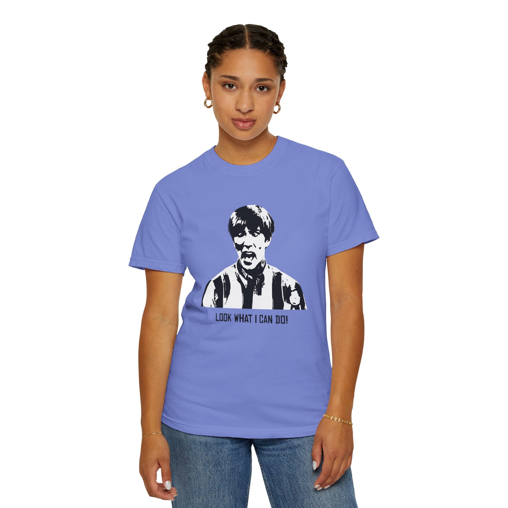 Woman modeling lavender-blue Stuart MadTV T-shirt standing with neutral expression.