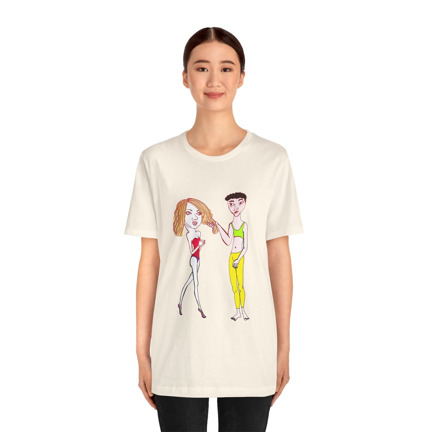 Woman standing in a cream Charlotte and Van hand-drawn couple tee, facing forward and smiling subtly.