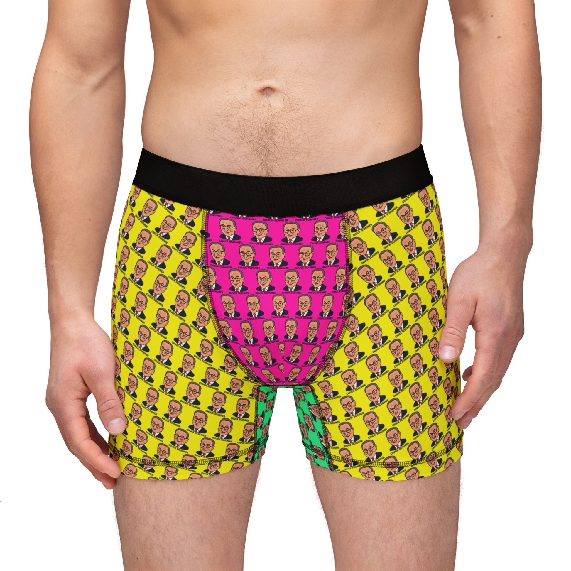 Male model standing wearing colorful Chuck Schumer boxer briefs with black waistband, front view