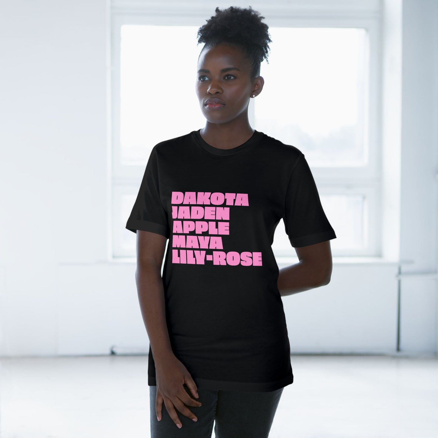 Black Nepo Babies List T-Shirt with pink lettering worn by female model