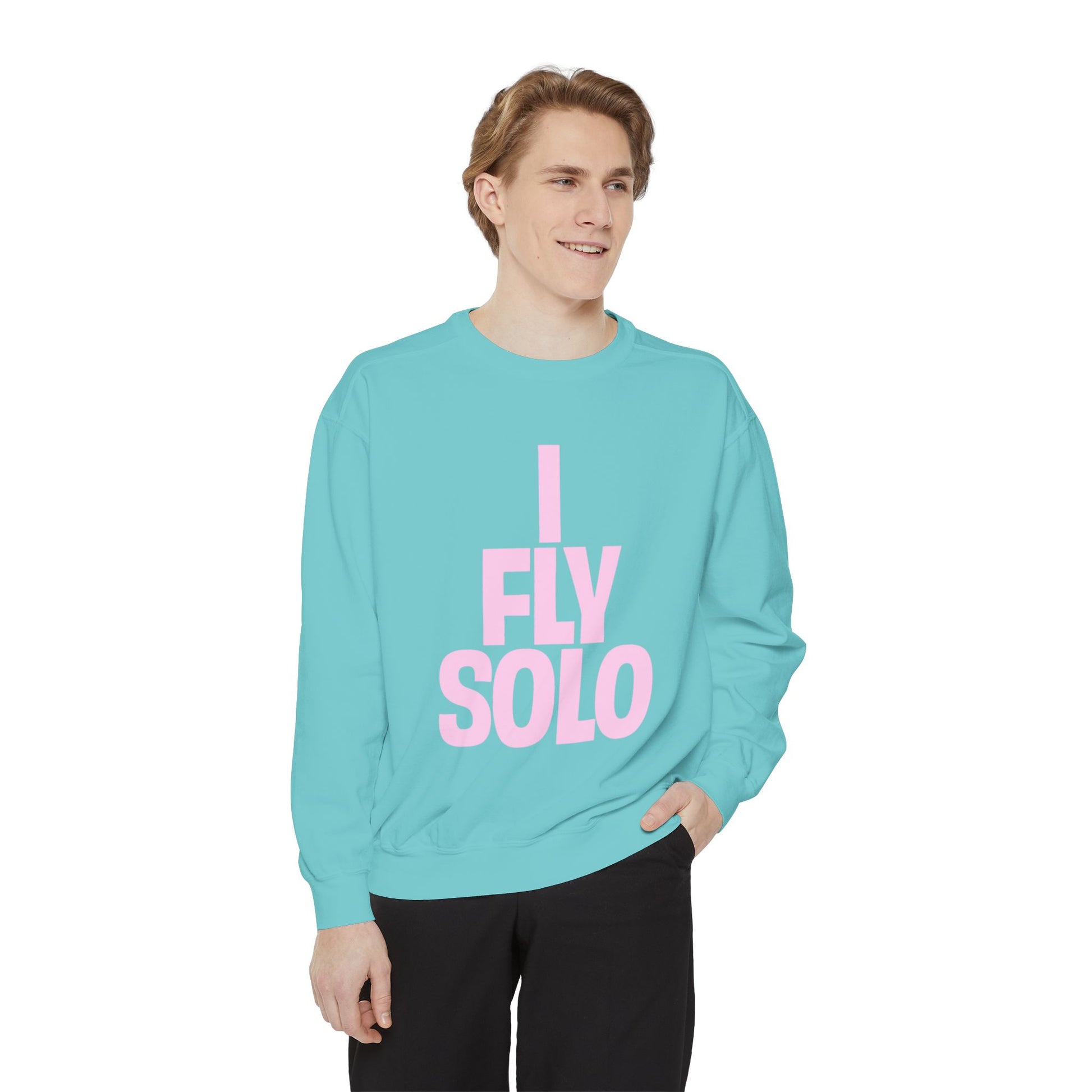 Person wearing a turquoise sweatshirt with 'I Fly Solo' text on a white background