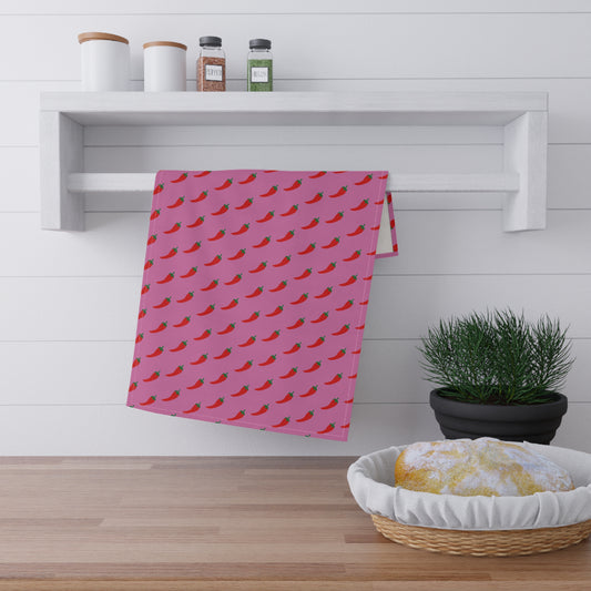 Pink Pepper Kitchen Towel hanging on rack in modern kitchen