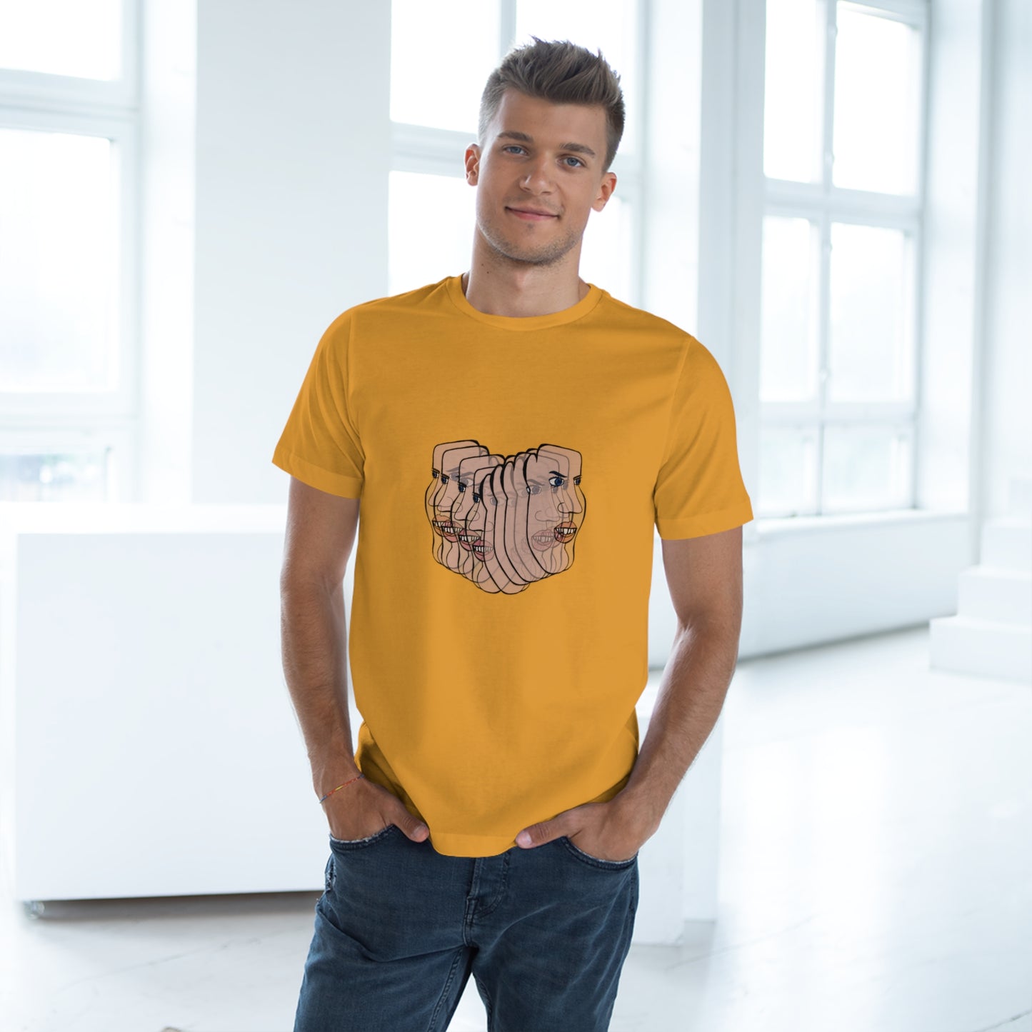 Man wearing mustard yellow Charlie t-shirt indoors, casual stance