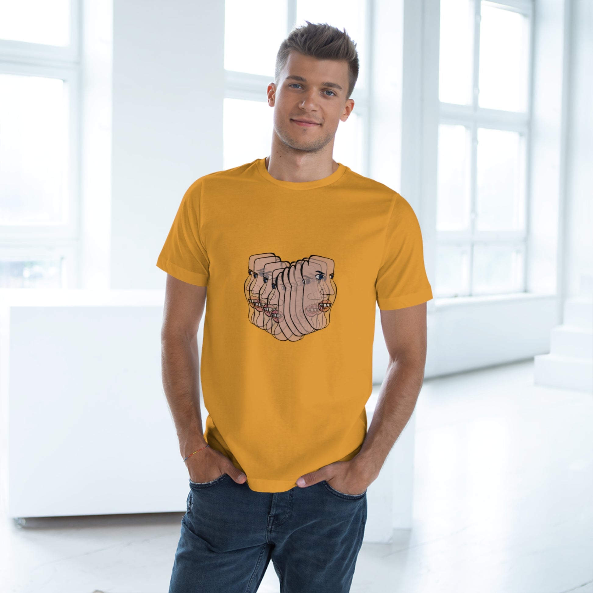 Man wearing mustard yellow Charlie t-shirt indoors, casual stance