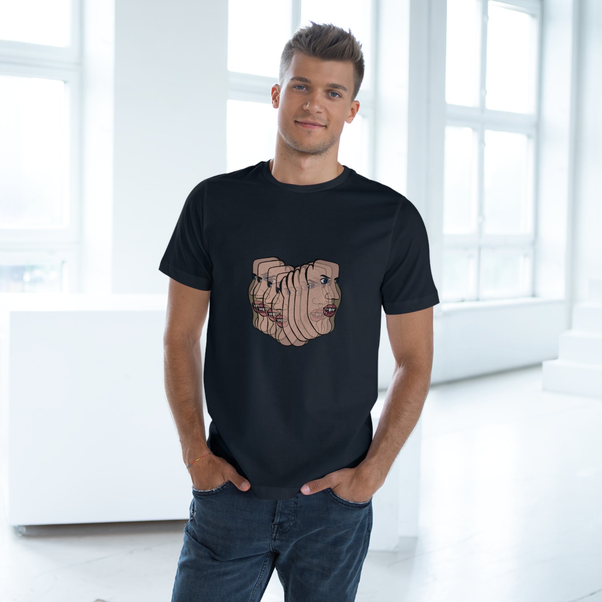Man in black Charlie tee looking away, bright modern interior