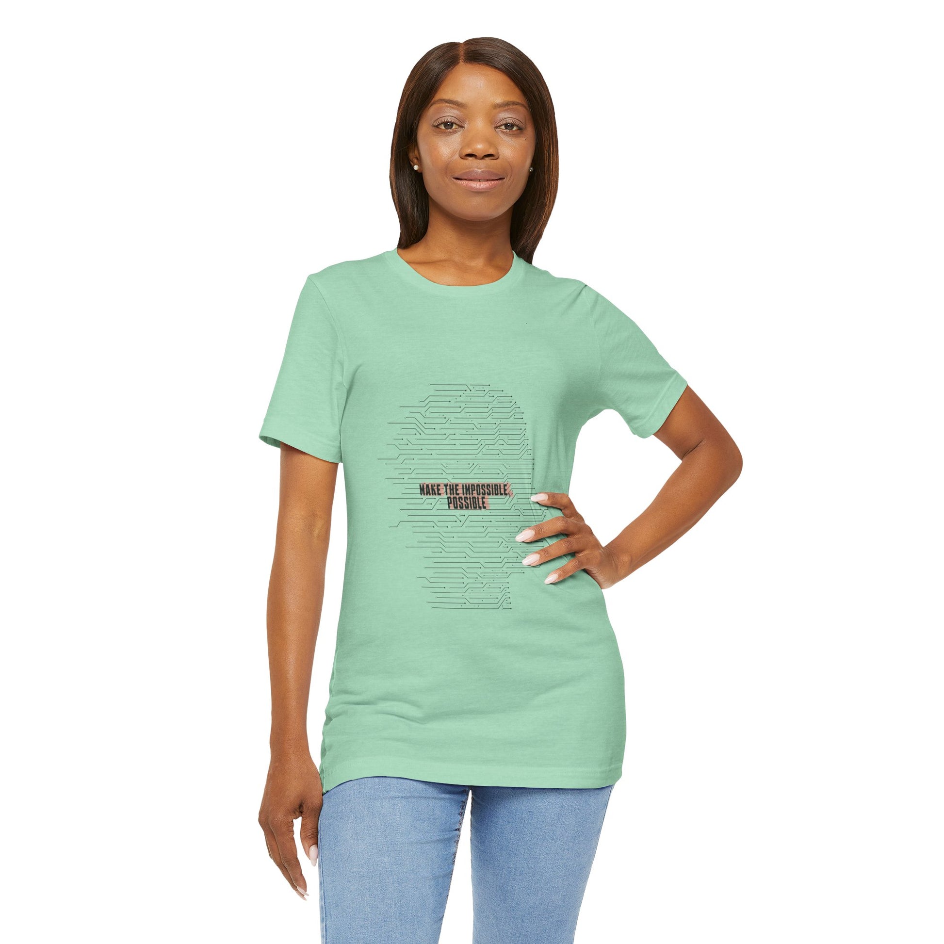Woman wearing green Make It Possible T-Shirt standing confidently.