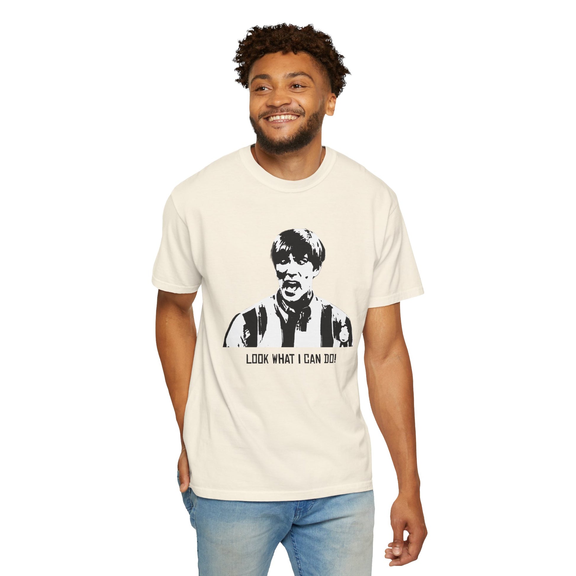 Man modeling beige Stuart T-shirt with hands at sides, smiling.