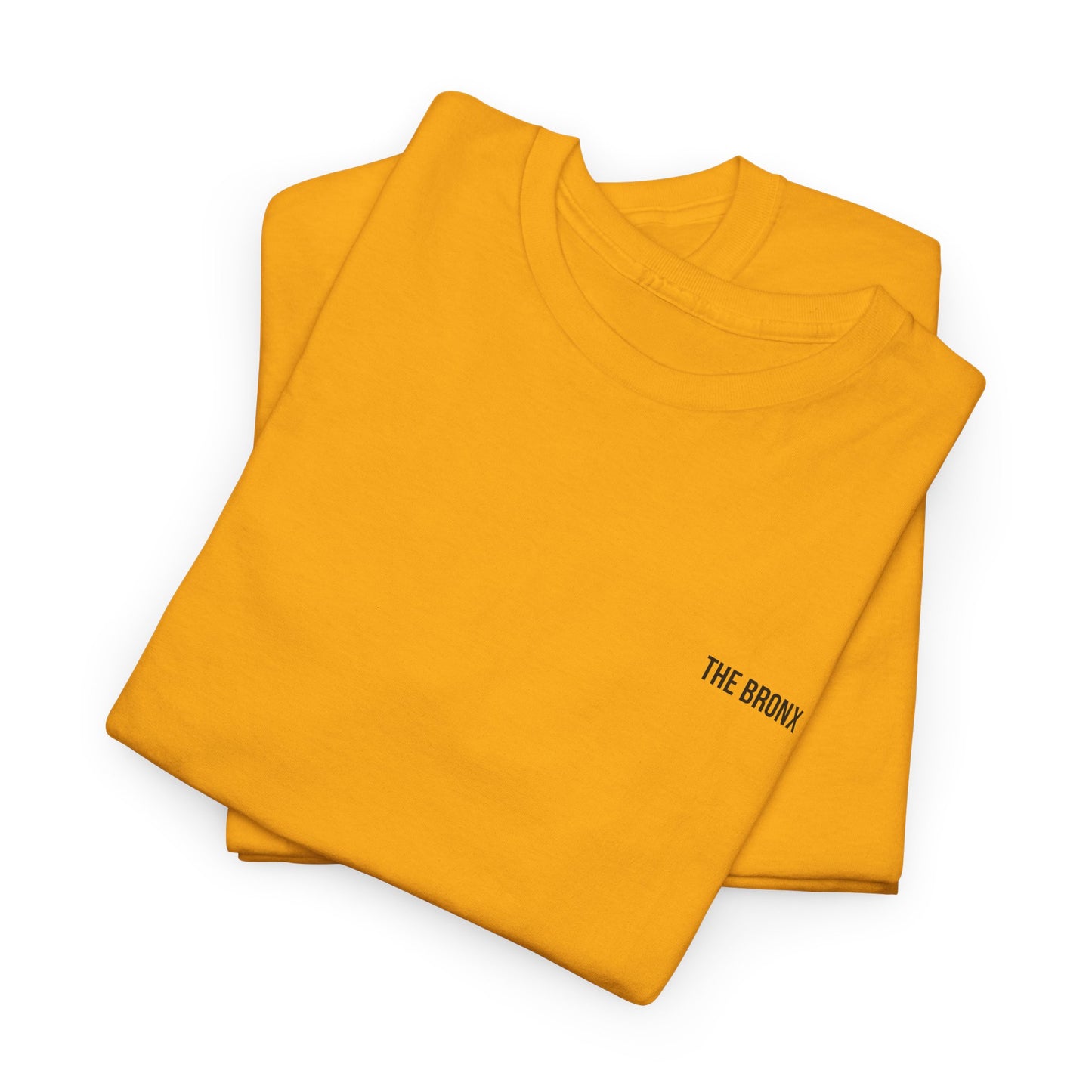 Two folded The Bronx T-Shirts in mustard yellow, flat lay