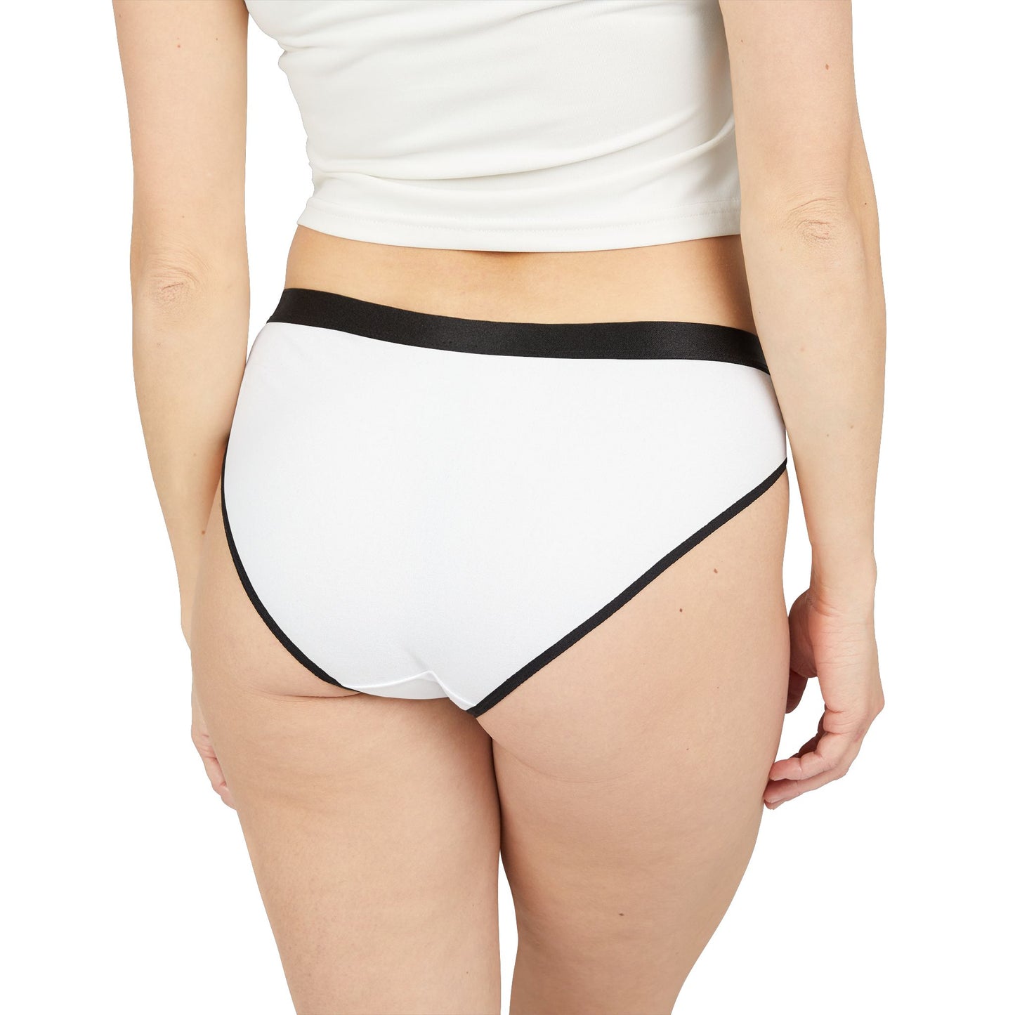White underwear with black trim worn by a person on a white background