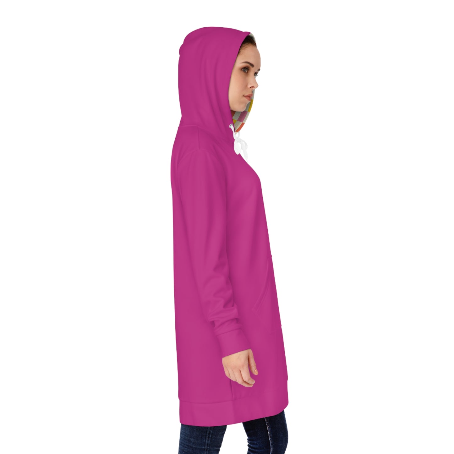Side view of woman wearing pink hoodie dress with hood up, showing length and profile