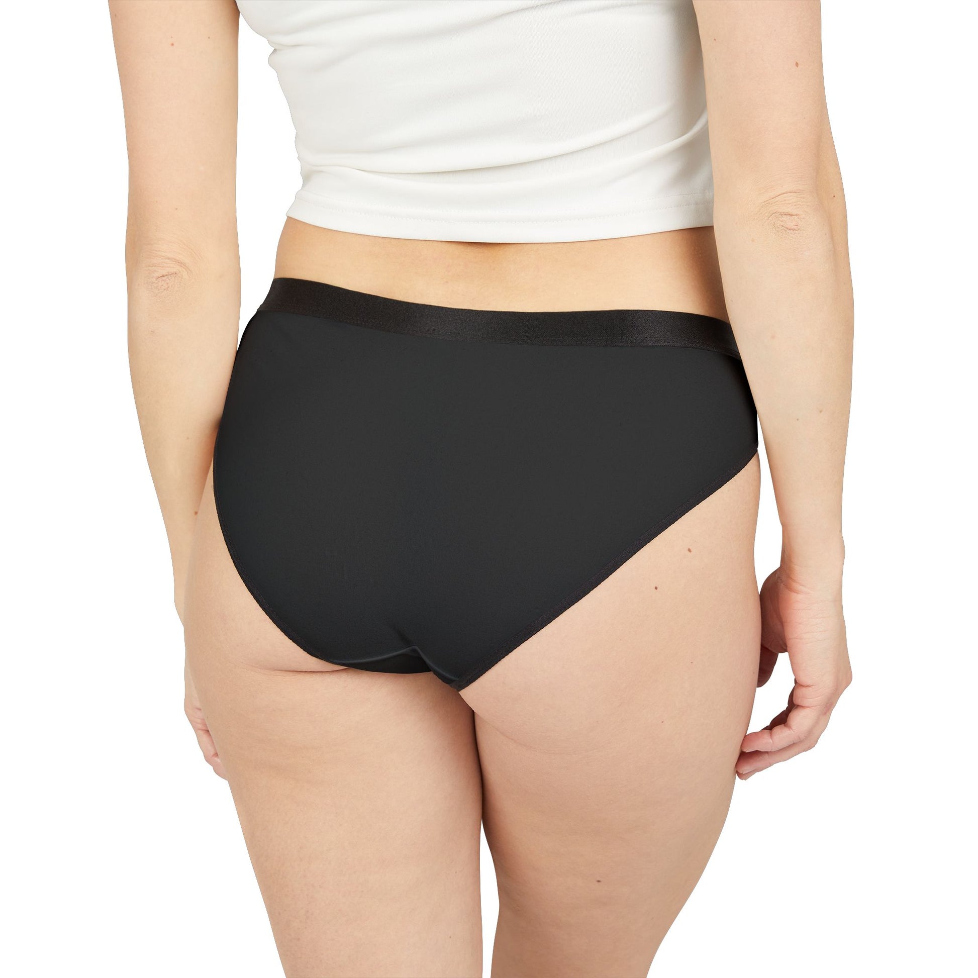 Model wearing black Saturday Panty back view showing solid black fabric and black waistband