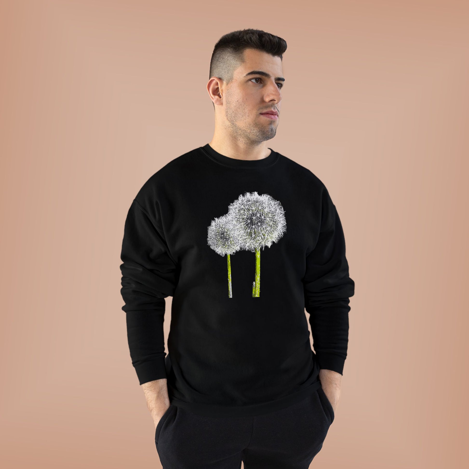 Man in black Tantrum Media Dandelion Unisex Sweatshirt with white dandelion print, peach background
