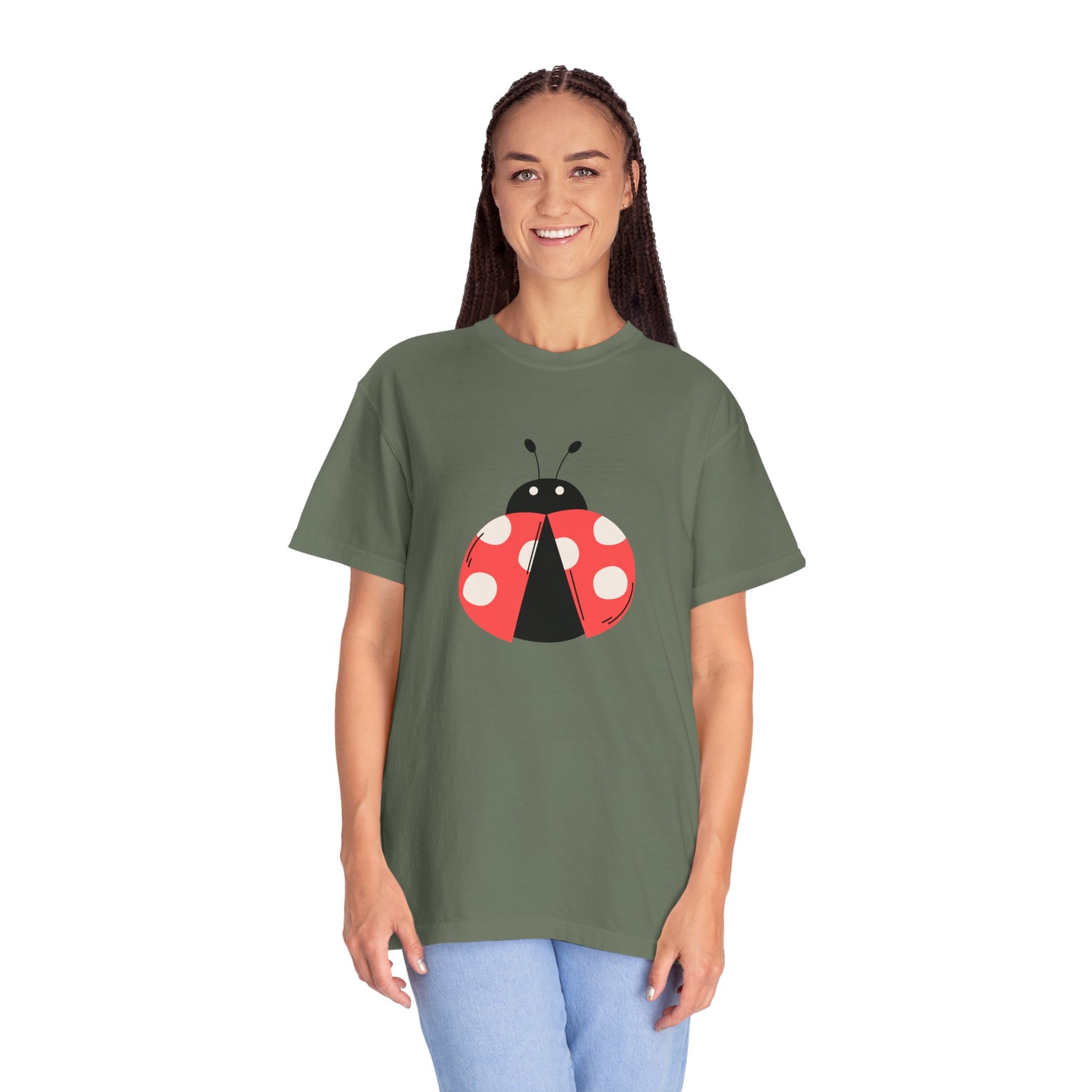 Woman wearing olive green Lady Bug T-Shirt with lady bug graphic.