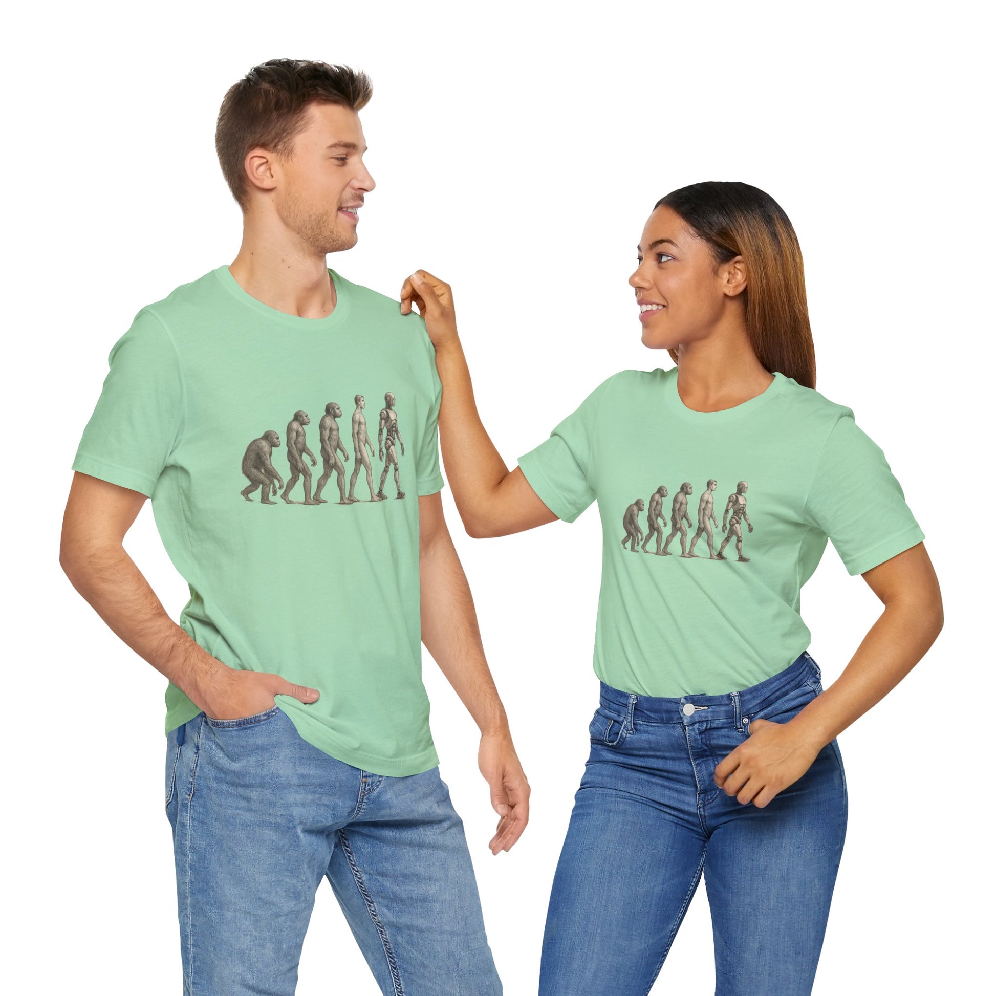 Two people wearing matching green t-shirts with a graphic design on a white background