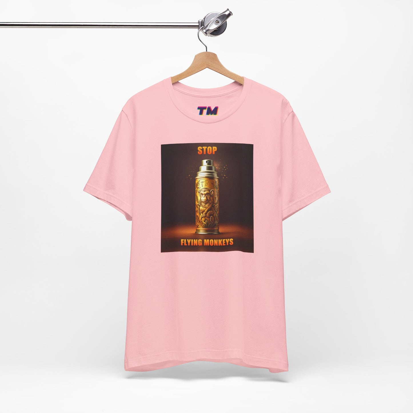 Pink Stop Flying Monkeys T-Shirt on hanger with bold front graphic