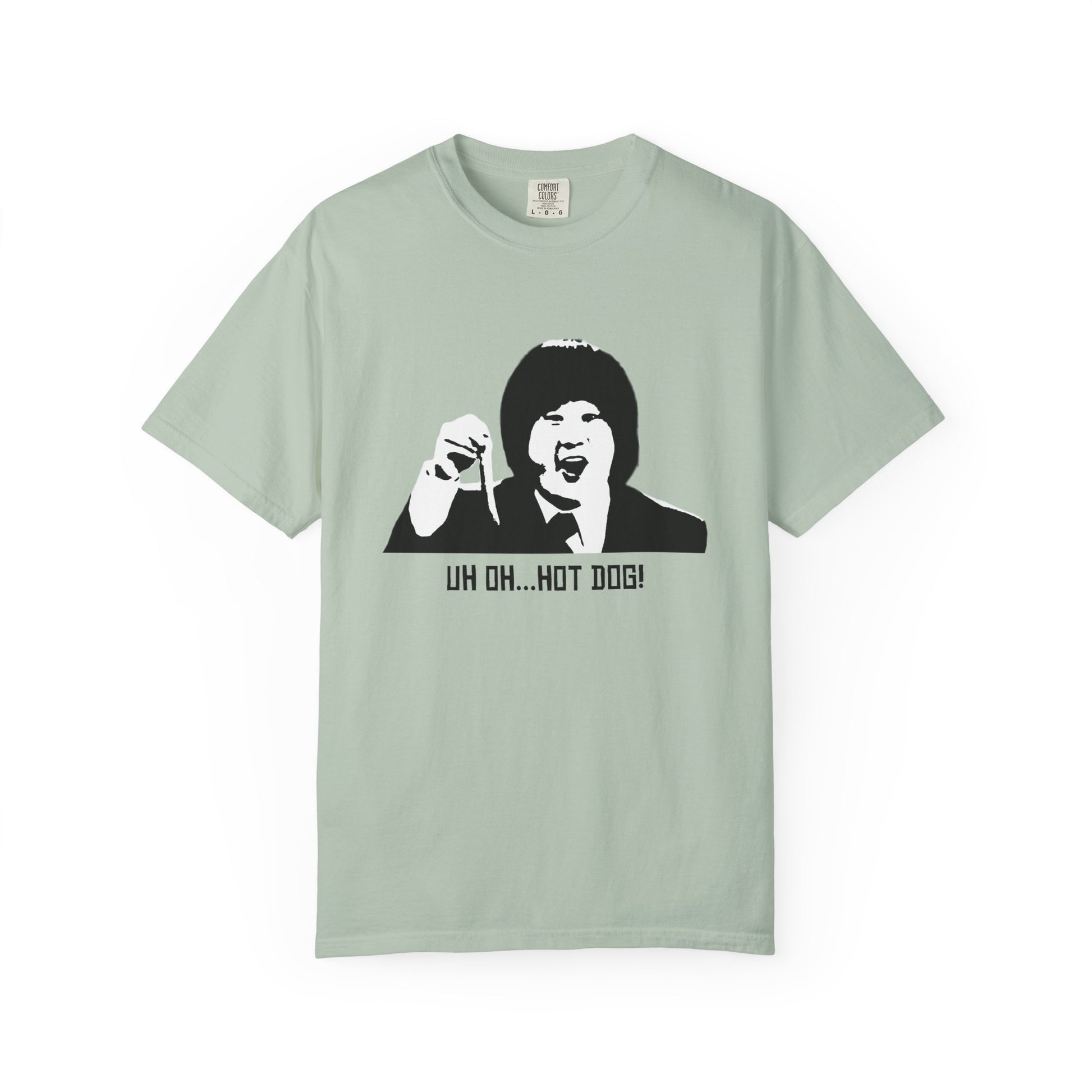 Light sage green Uh Oh Hot Dog T-shirt laid flat with graphic print.