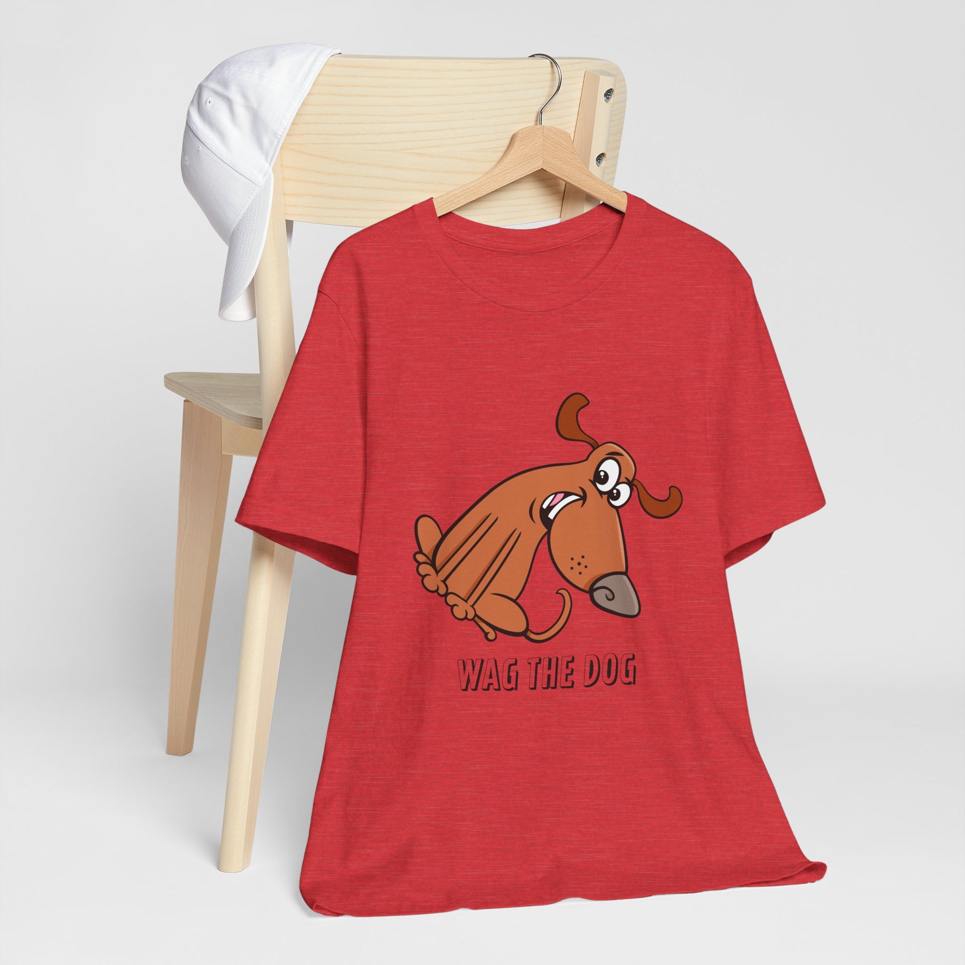 Wag The Dog T-Shirt flat lay in red with dog illustration