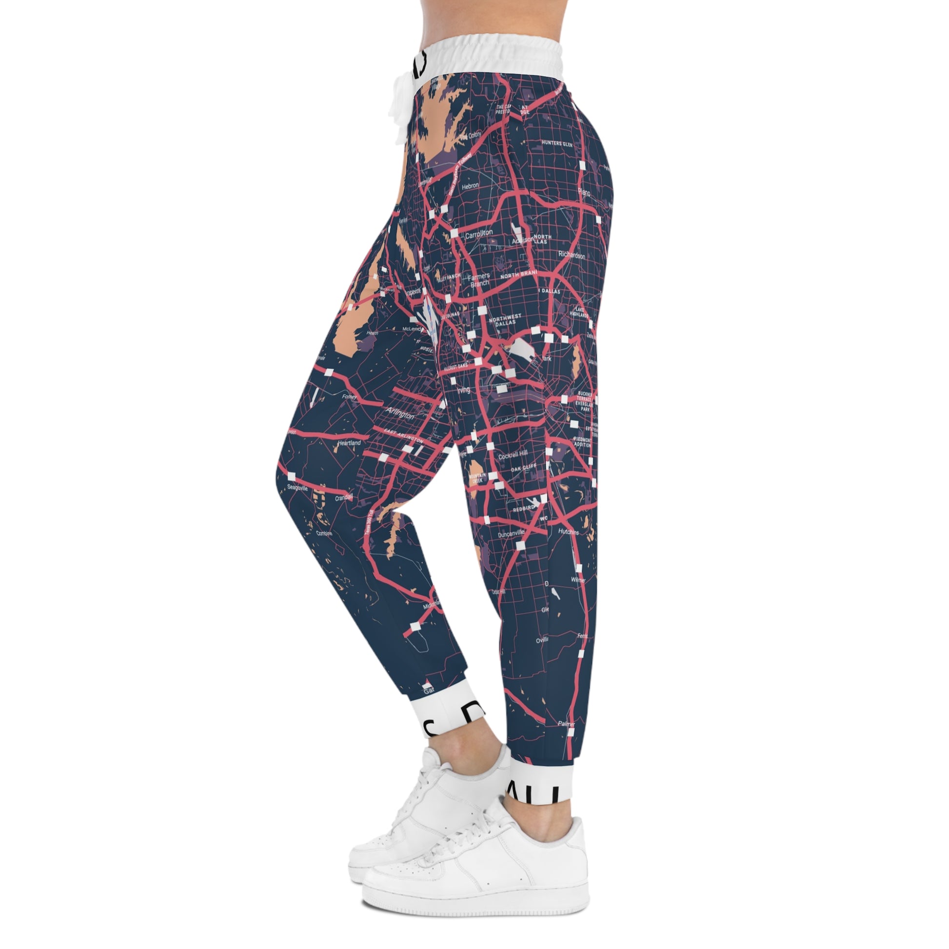 Pants with a map design worn by a person on a white background