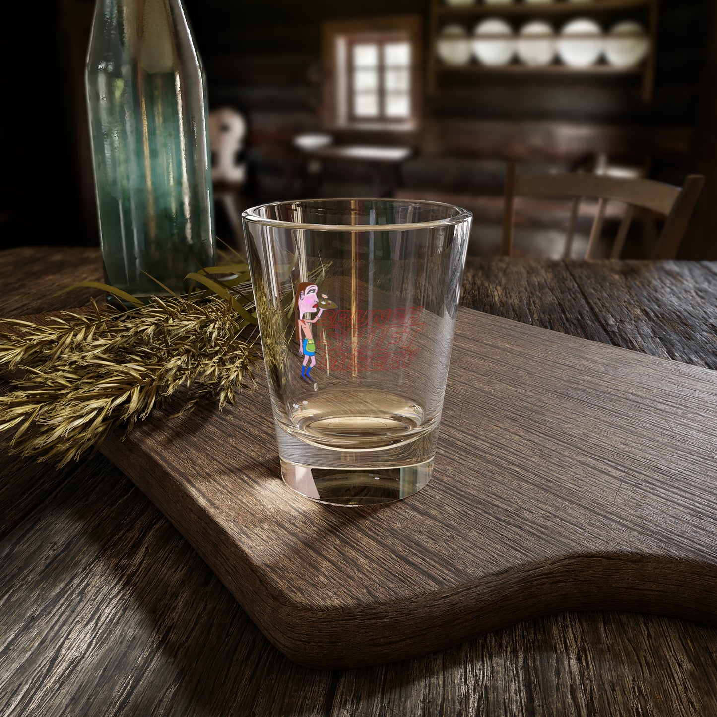 Clear glass with a printed design on a wooden surface in a rustic setting